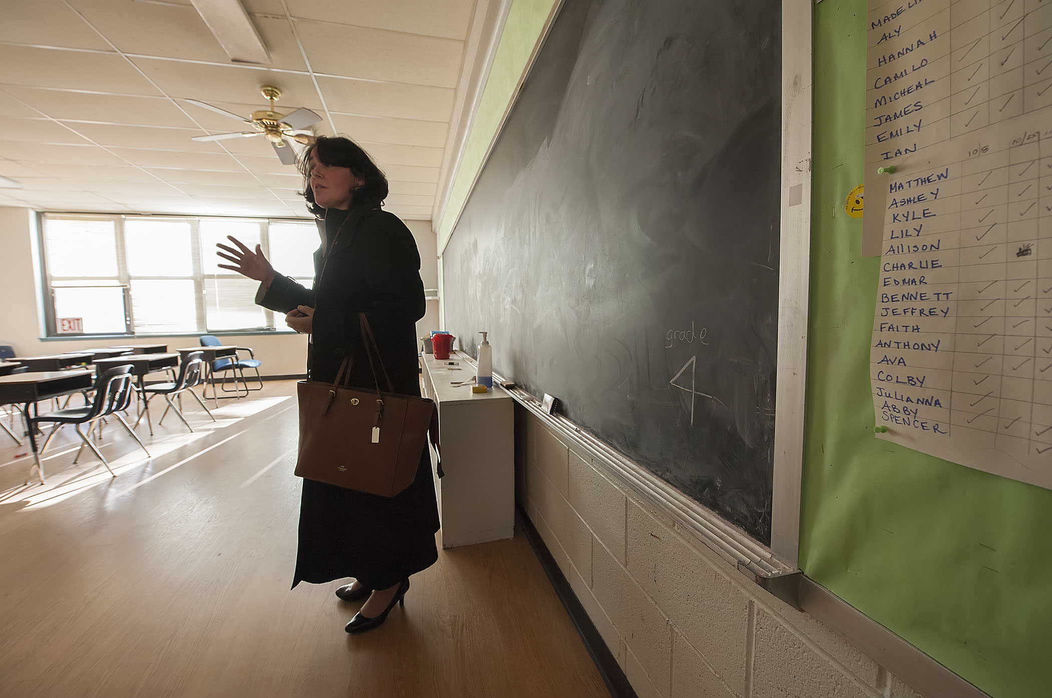 Sag Harbor superintendent Katy Graves speaks to journalists inside a classroom in the former Stella Maris Regional School