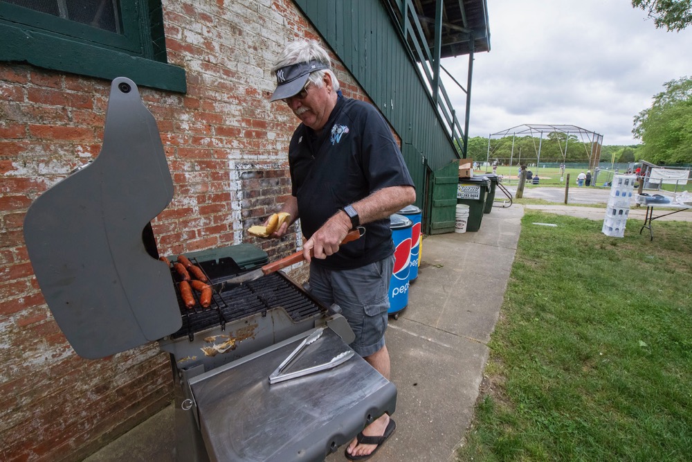 Former Sag Harbor Whalers General Manager Tom Gleeson cooking up some hot dogs earlier this season. Michael Heller photo