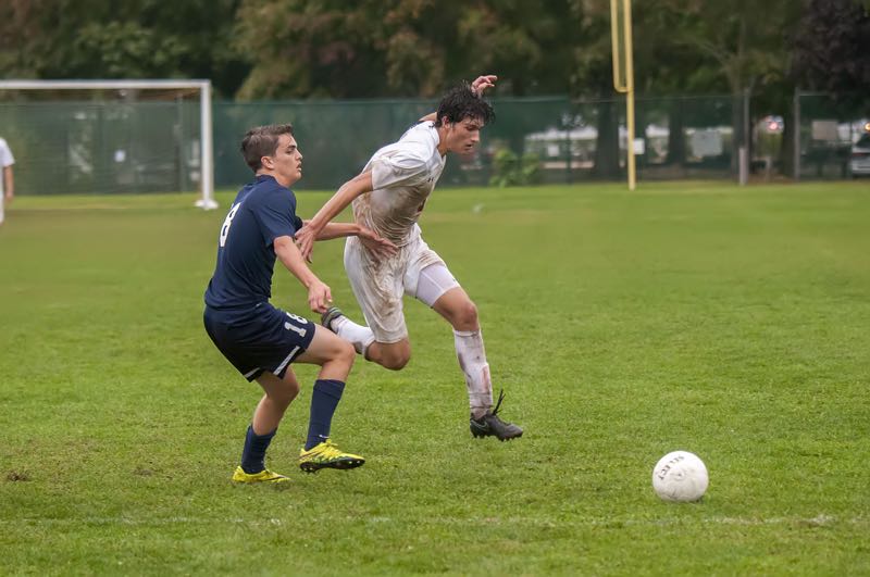 Sam Warne fights for control of the ball during Pierson's win over Stony Brook. Michael Heller photos