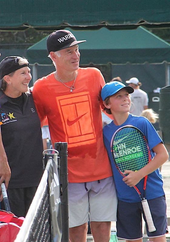 John McEnroe with two young players at a previous Johnny Mac Tennis Project’s Pro-Am in the Hamptons. Courtesy photo