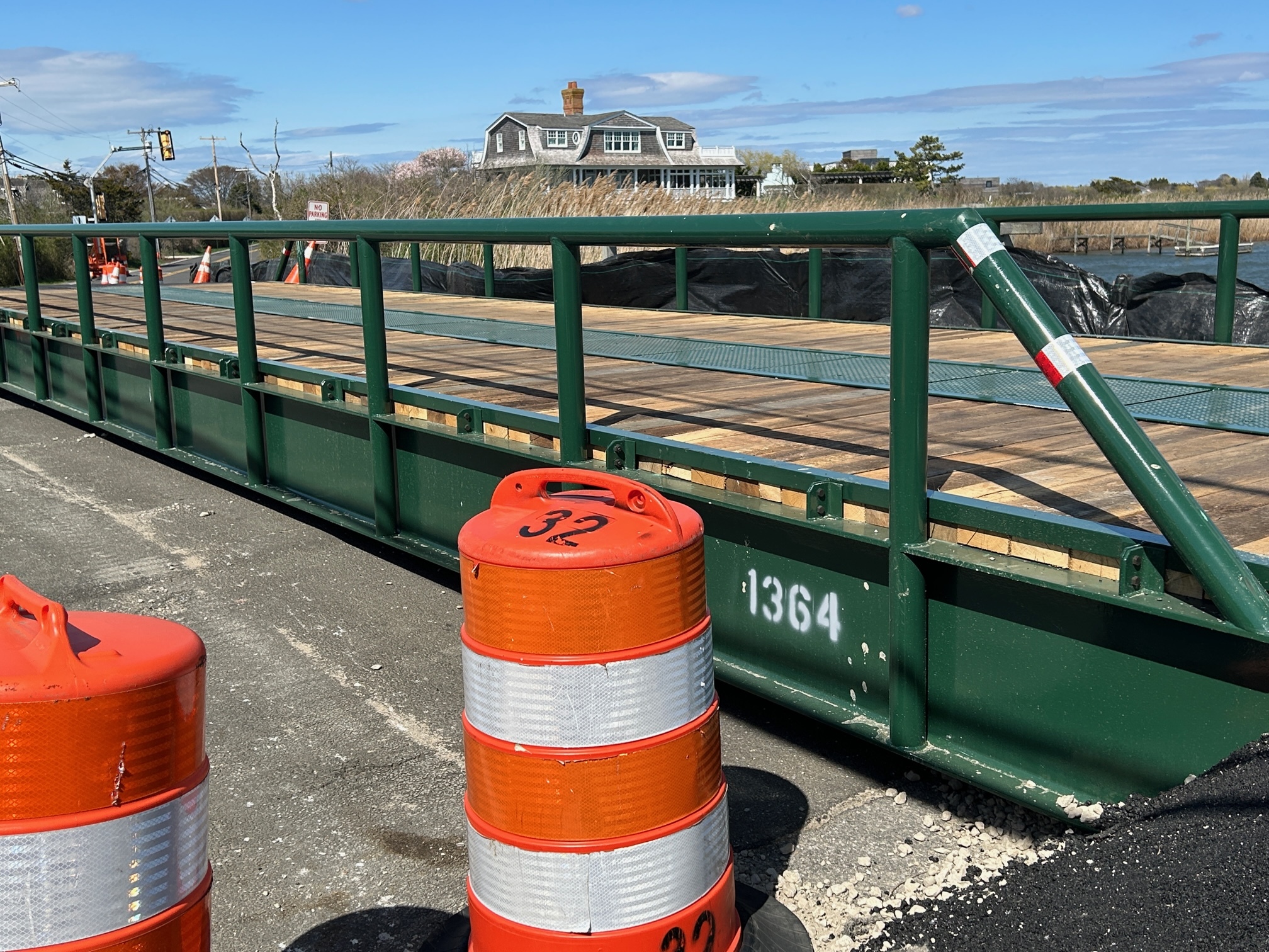 A prefab bridge placed atop the deteriorating structure on Jobs Lane in Bridgehampton will allow the Town Highway Department to bring heavy paving equipment to Dune Road.    KITTY MERRILL