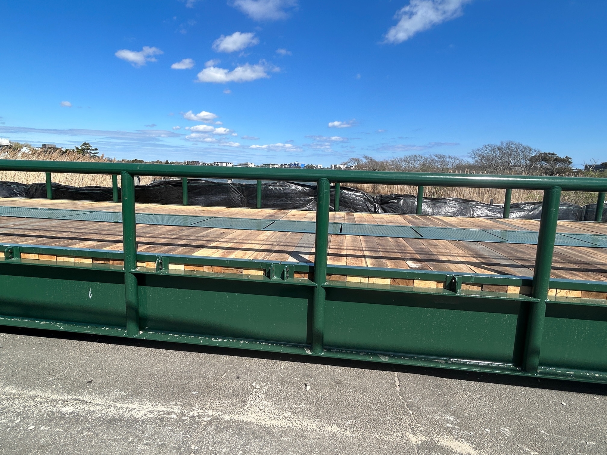 With the existing bridge on Jobs Lane not strong enough to handle heavy equipment, Town Highway Superintendent Charles McArdle had a temporary prefab structure placed last week. It saves millions in bridge repairs, and will allow workers to pave  Dune Road and beach parking lots in Bridgehampton.    KITTY MERRILL