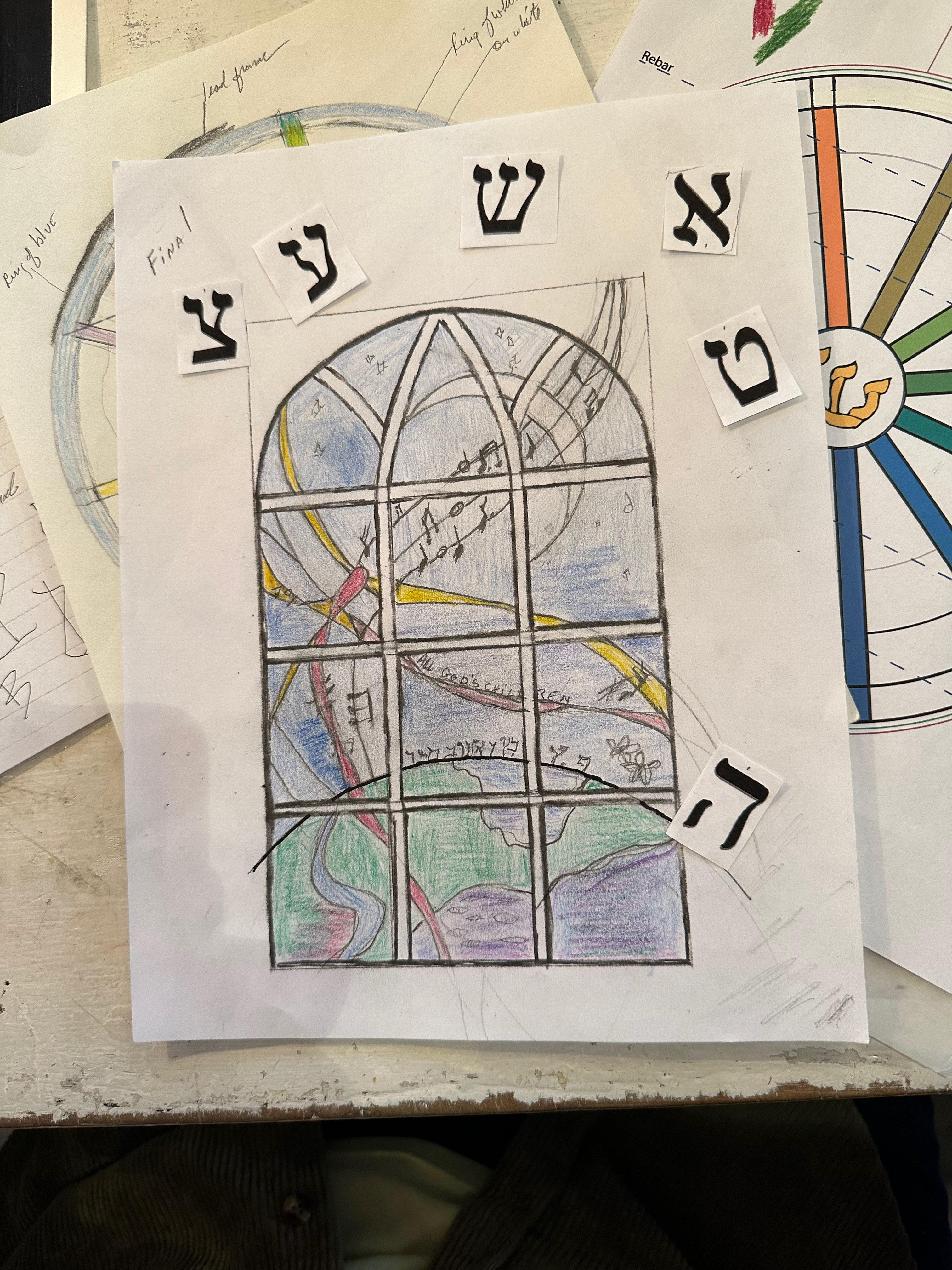 Romany Kramoris at work on a new stained glass window design for Temple Adas Israel. ANNETTE HINKLE