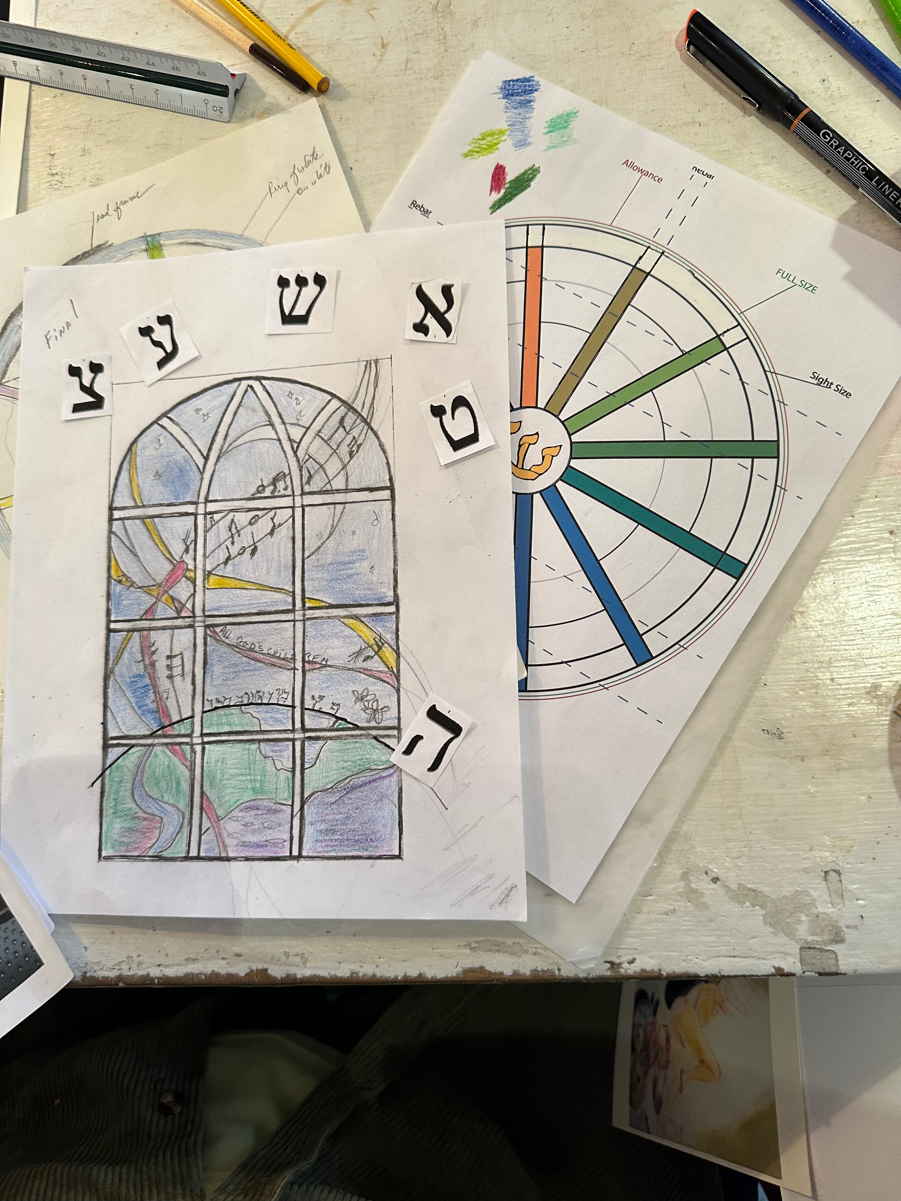 Romany Kramoris at work on a new stained glass window design for Temple Adas Israel. ANNETTE HINKLE