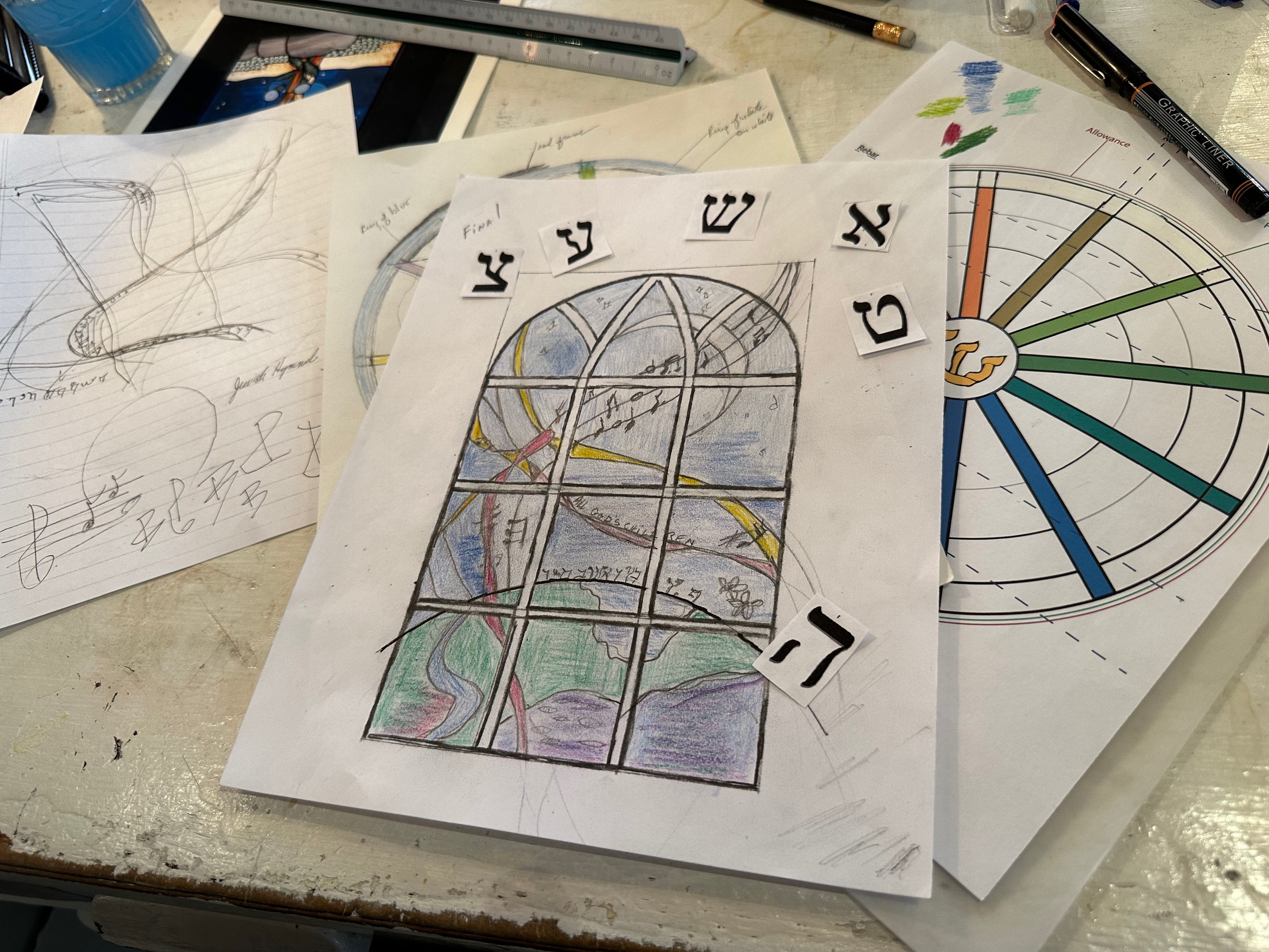 Romany Kramoris at work on a new stained glass window design for Temple Adas Israel. ANNETTE HINKLE