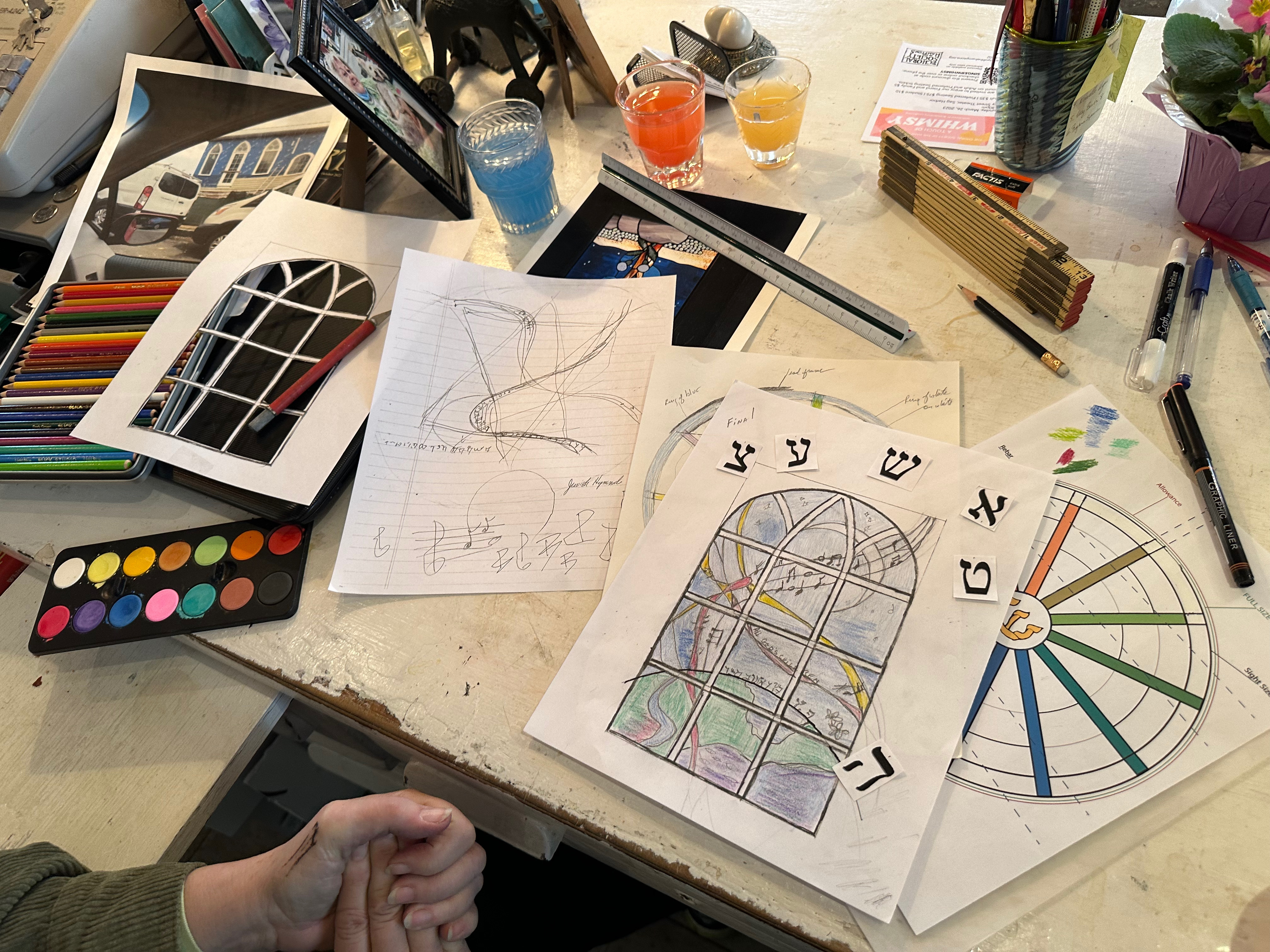 Romany Kramoris at work on a new stained glass window design for Temple Adas Israel. ANNETTE HINKLE