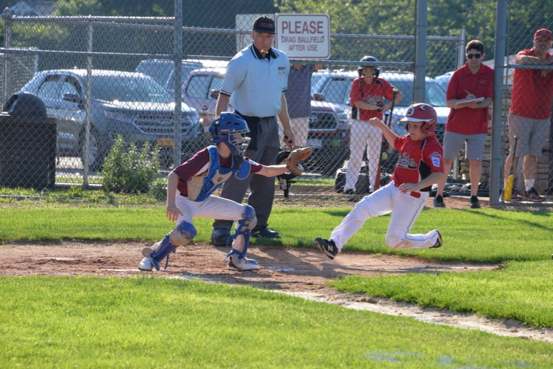Jeffrey Gregor slides in ahead of a throw to home plate. Michelle Malone photos