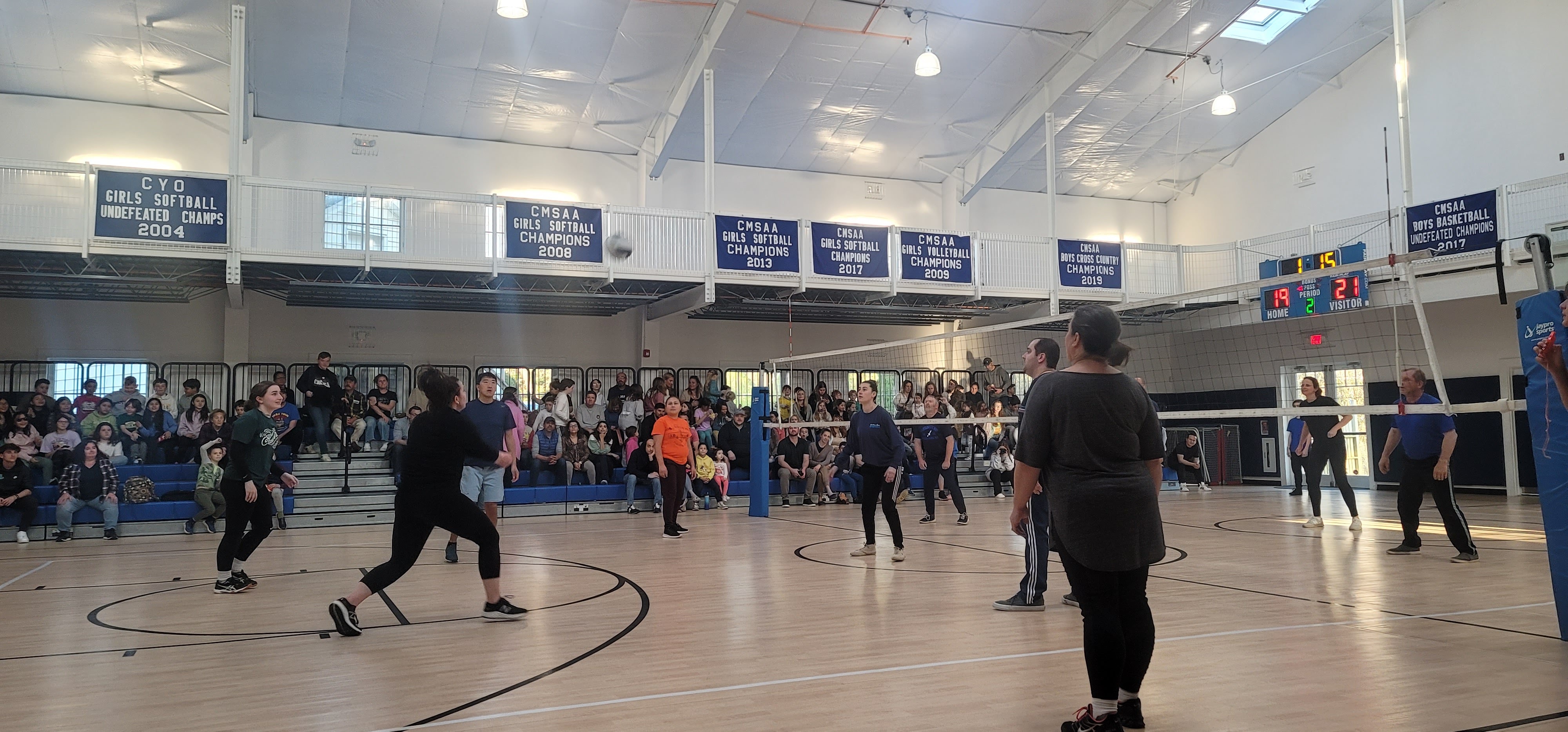 Our Lady of the Hamptons School's  Prep 8 class hosted a faculty-parent-student volleyball event with a packed house of fans. Faculty took the win. At the close of the event, the championship banner for the boys basketball team was unveiled. COURTESY OUR LADY OF THE HAMPTONS SCHOOL