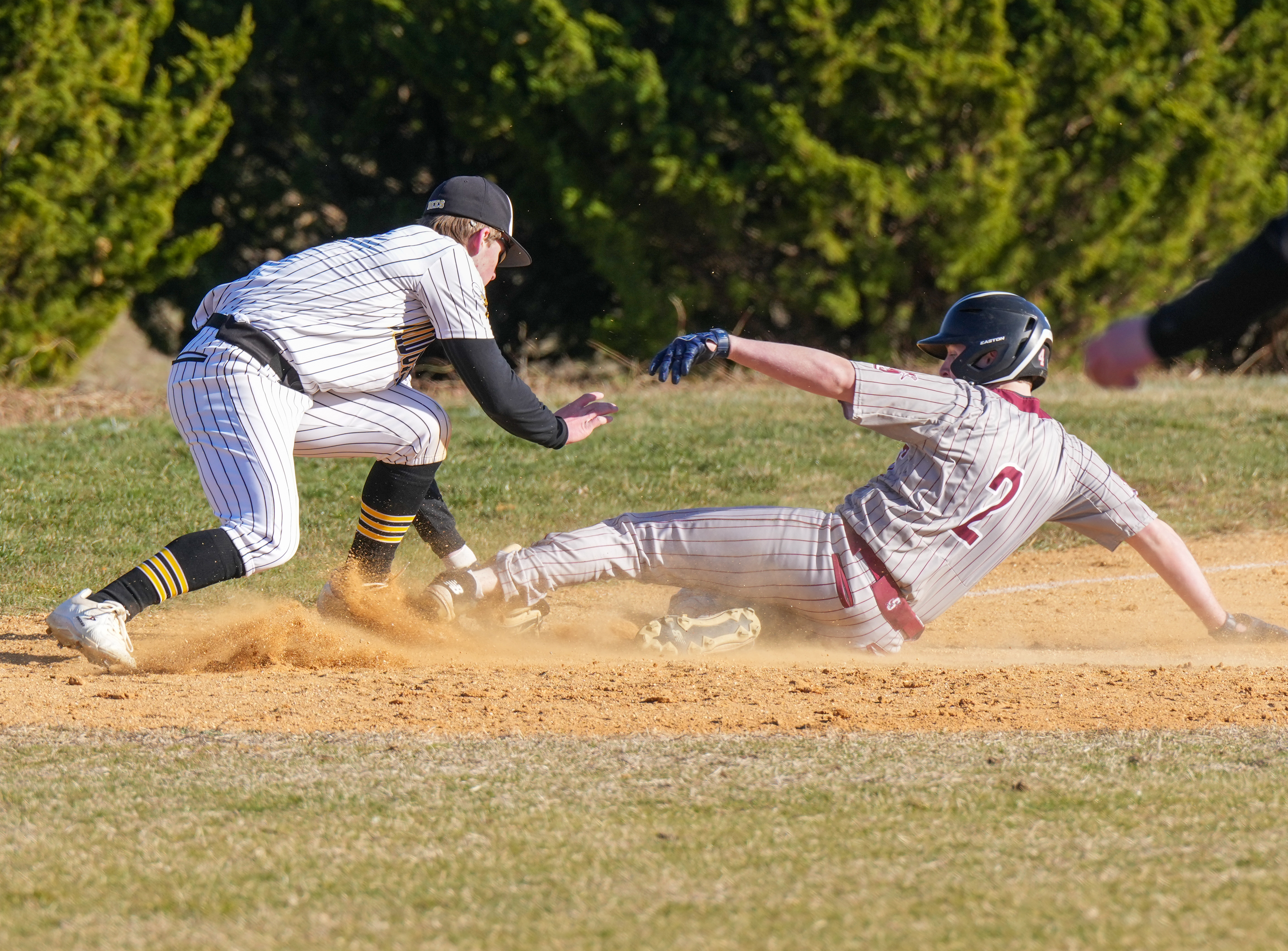 Southampton sophomore Daniel McDonnell slides into third base.   RON ESPOSITO