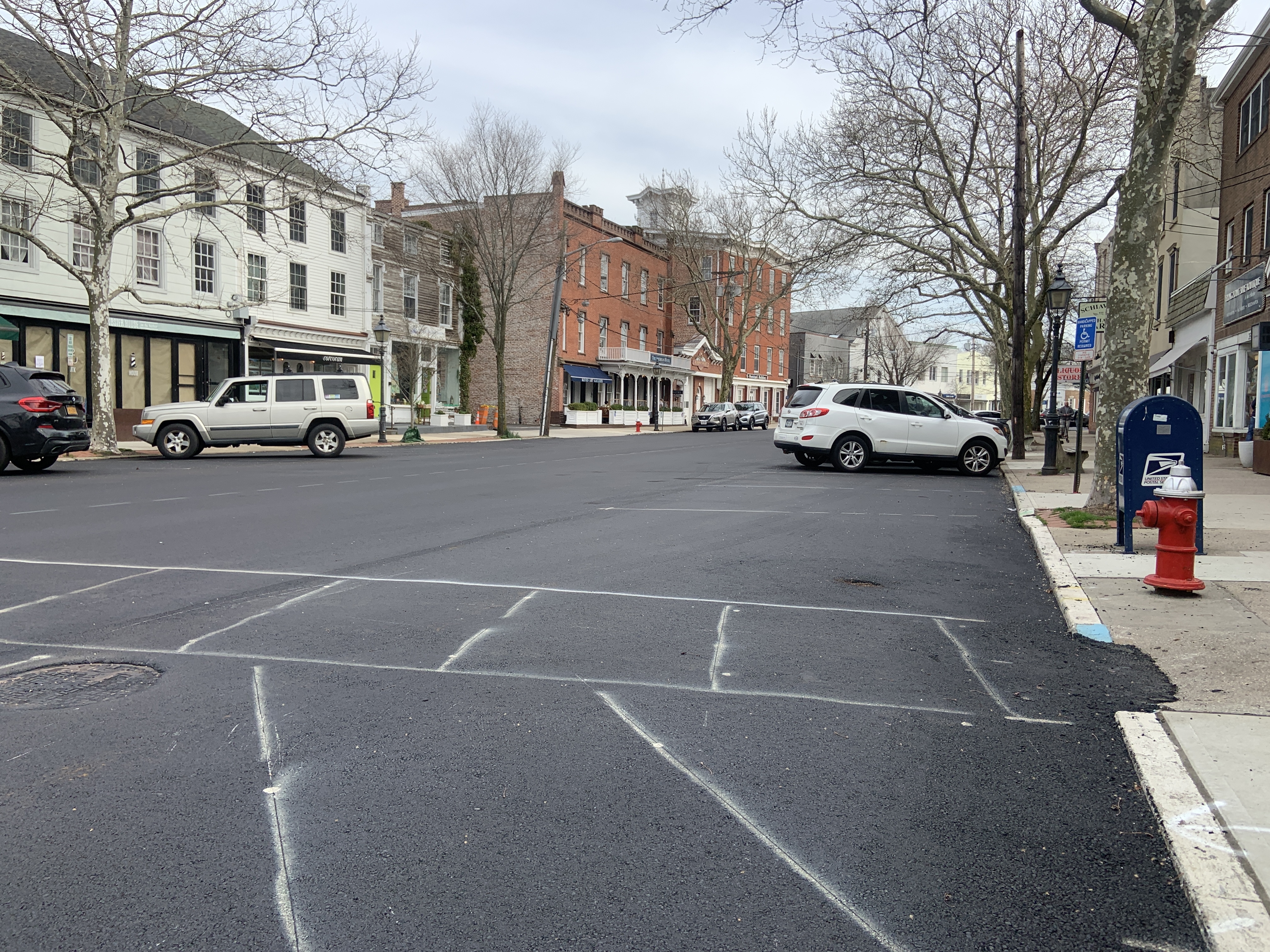 Main Street in Sag Harbor was open to traffic both Monday and Tuesday afternoons as contractors made fast progress on a repaving project. Only the final striping needed to be done by Tuesday afternoon. STEPHEN J. KOTZ