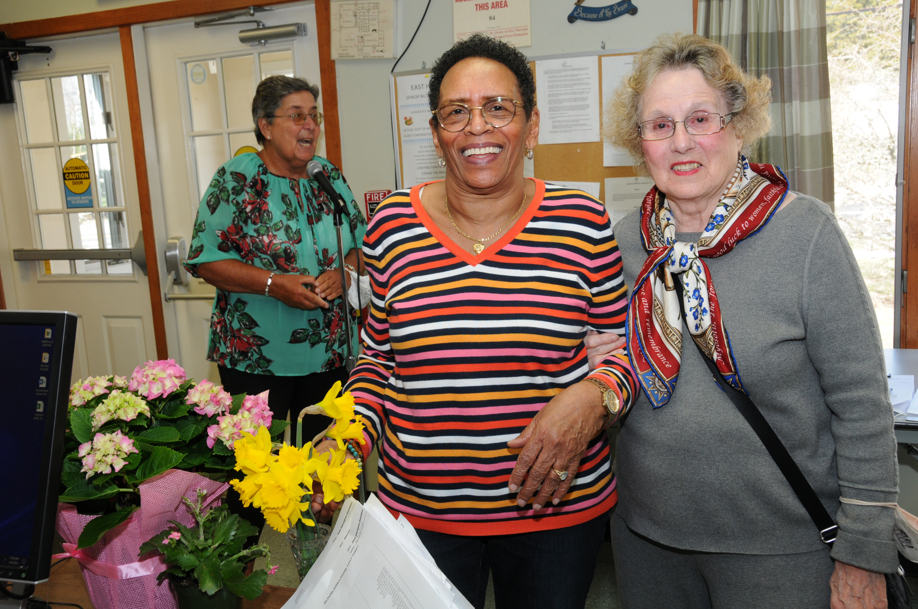 Vickie Lundin, Audrey Gaines and Mary Ella Moeller at the East Hampton Senior Center on Springs Fireplace Road on April 4. Local Seniors were invited for lunch and to take home goodies, including floral table arrangements and their choice of gift from a selection of items from the  Shops at LVIS (East Hampton Ladies' Village Improvement Society). Gift certificates to the Shops were also raffled.      RICHARD LEWIN