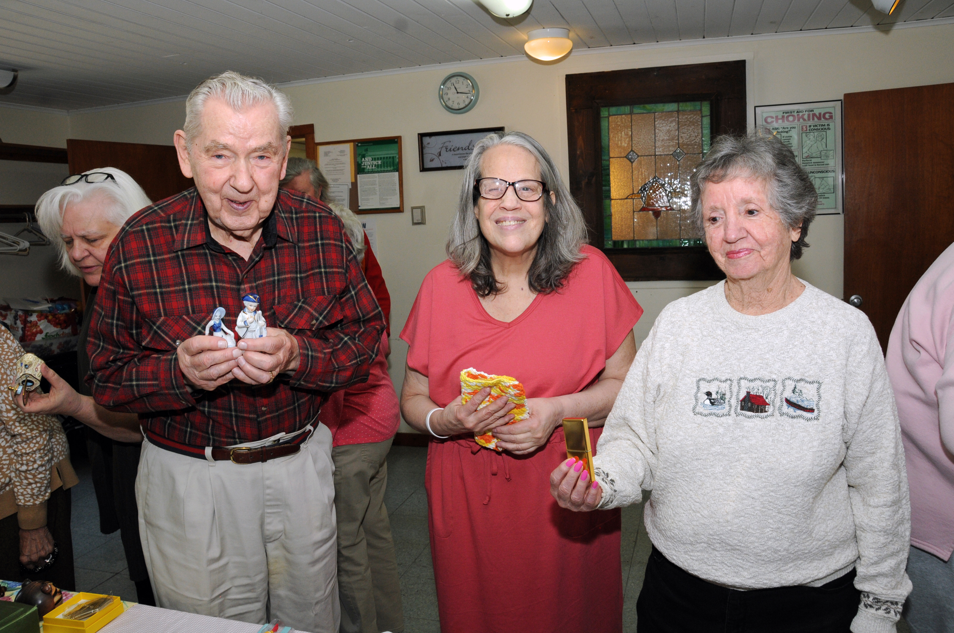 Val Hindra, Debi Kins and Alicia Hoyt at the East Hampton Senior Center on Springs Fireplace Road on April 4. Local Seniors were invited for lunch and to take home goodies, including floral table arrangements and their choice of gift from a selection of items from the  Shops at LVIS (East Hampton Ladies' Village Improvement Society). Gift certificates to the Shops were also raffled.      RICHARD LEWIN