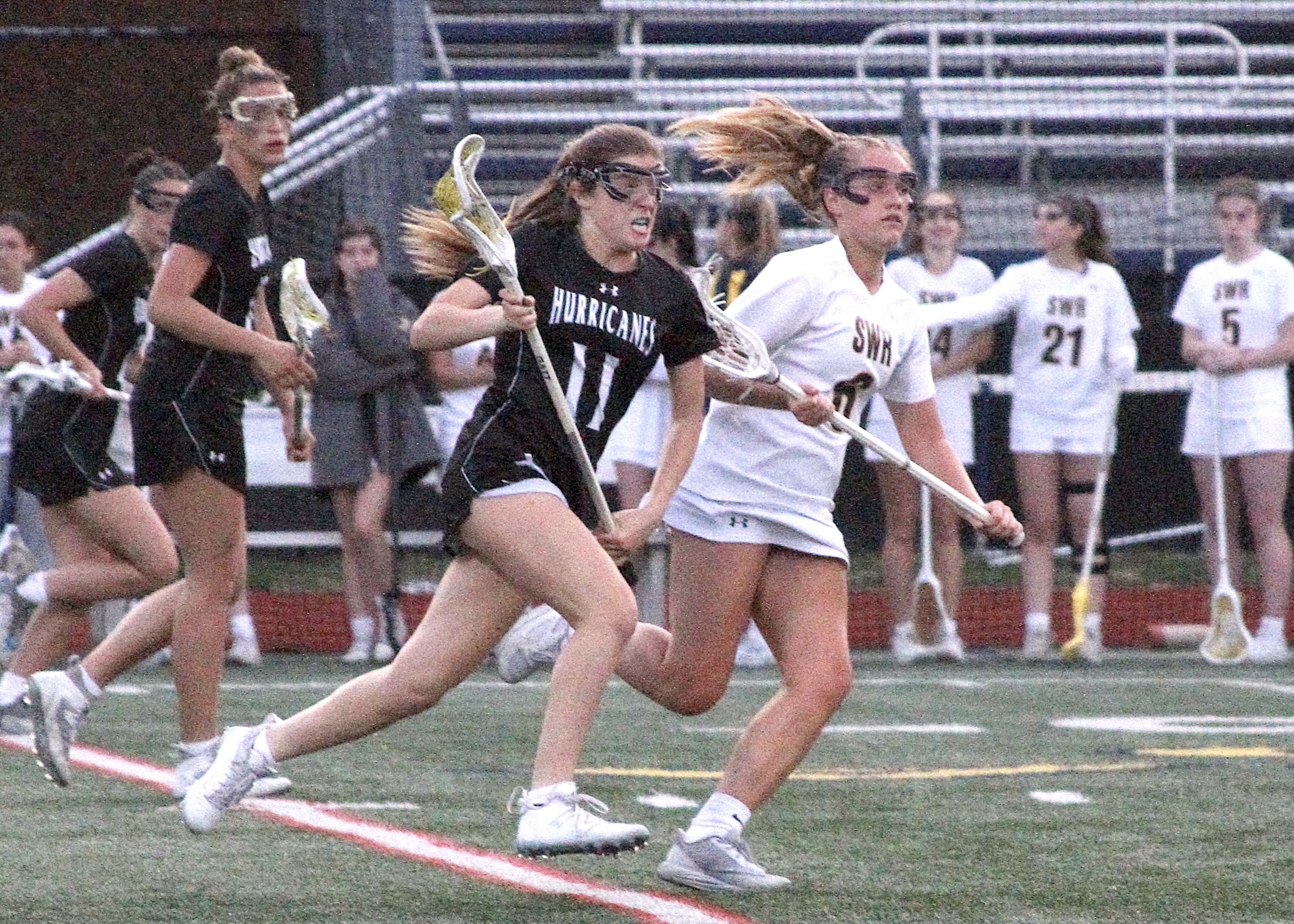 Sophomore defender Hailey Donahoe charges up the field after scooping up a ground ball. DESIRÉE KEEGAN