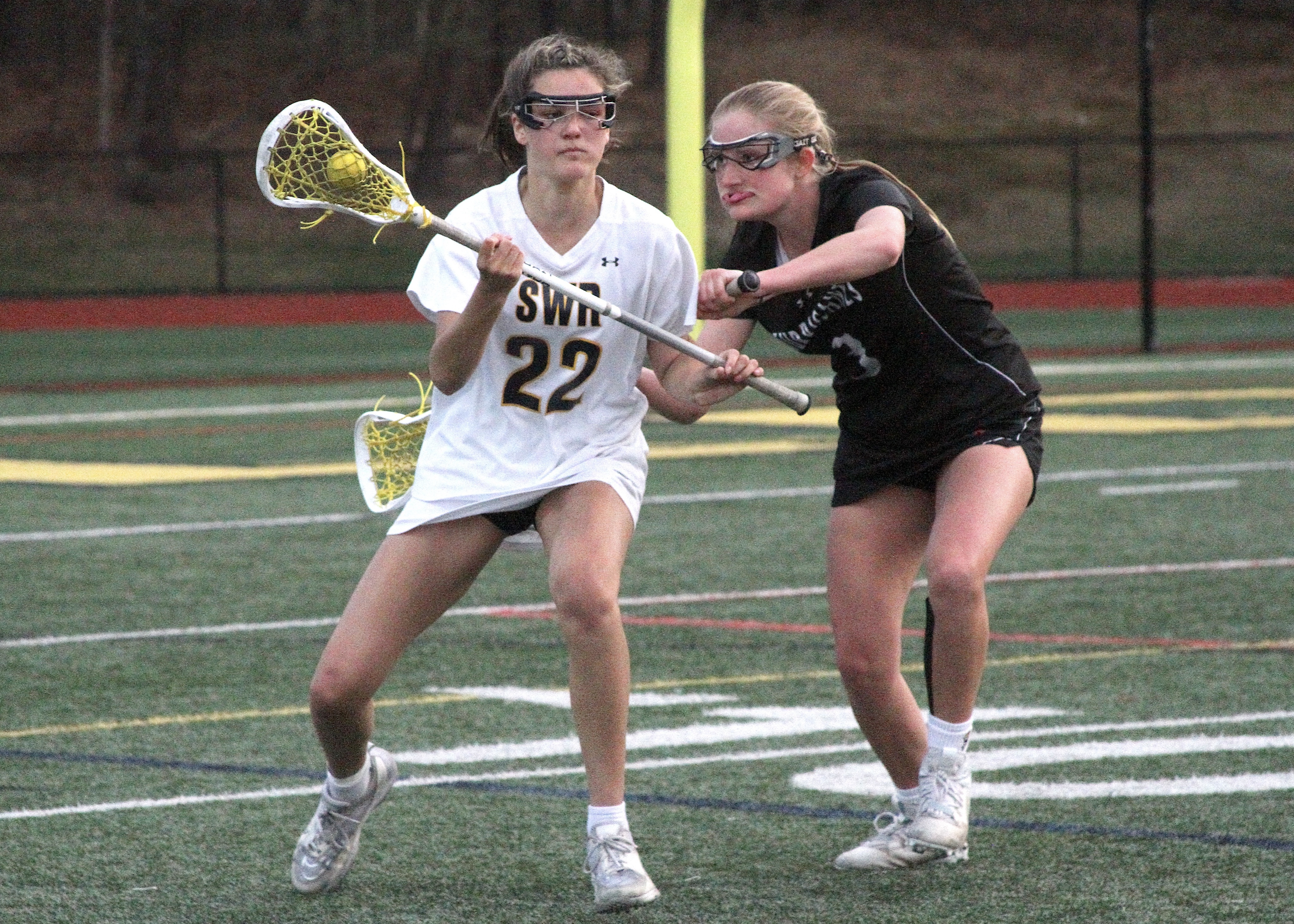 Sophomore defender and midfielder Lily Graves keeps her challenger away from the goal. DESIRÉE KEEGAN