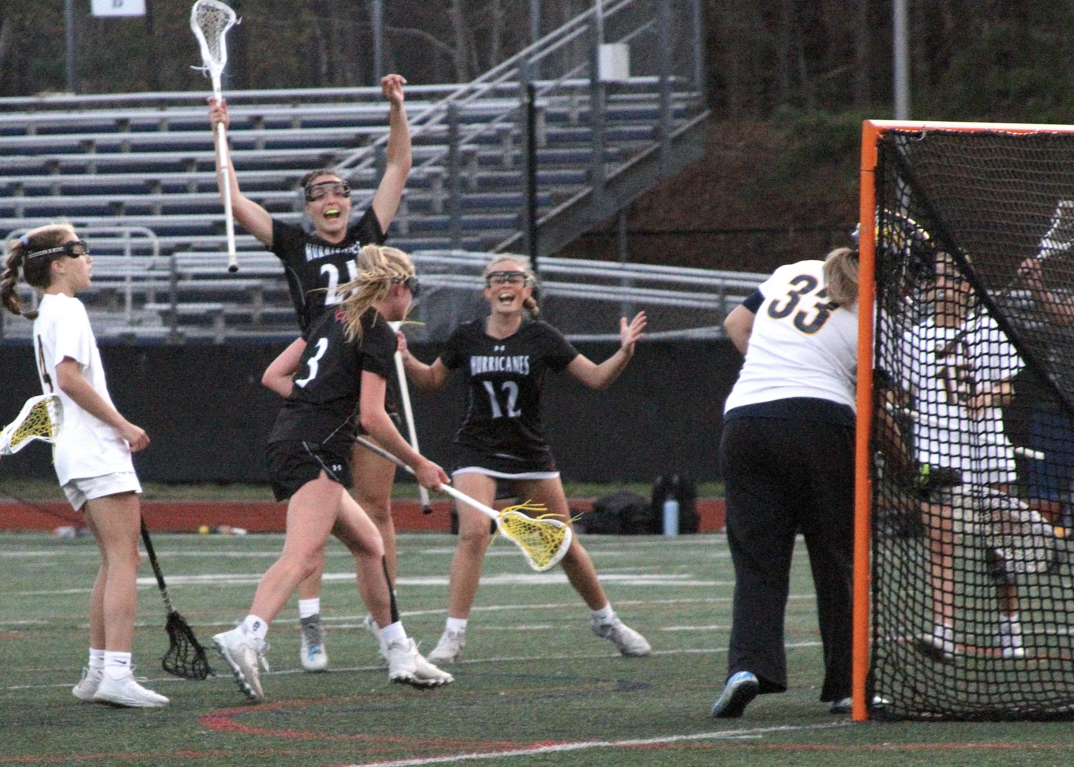 Senior midfielder and defender Reilly Mahon and  sophomore attack Meaghan Tufano celebrate Lily Graves' game-tying goal. DESIRÉE KEEGAN