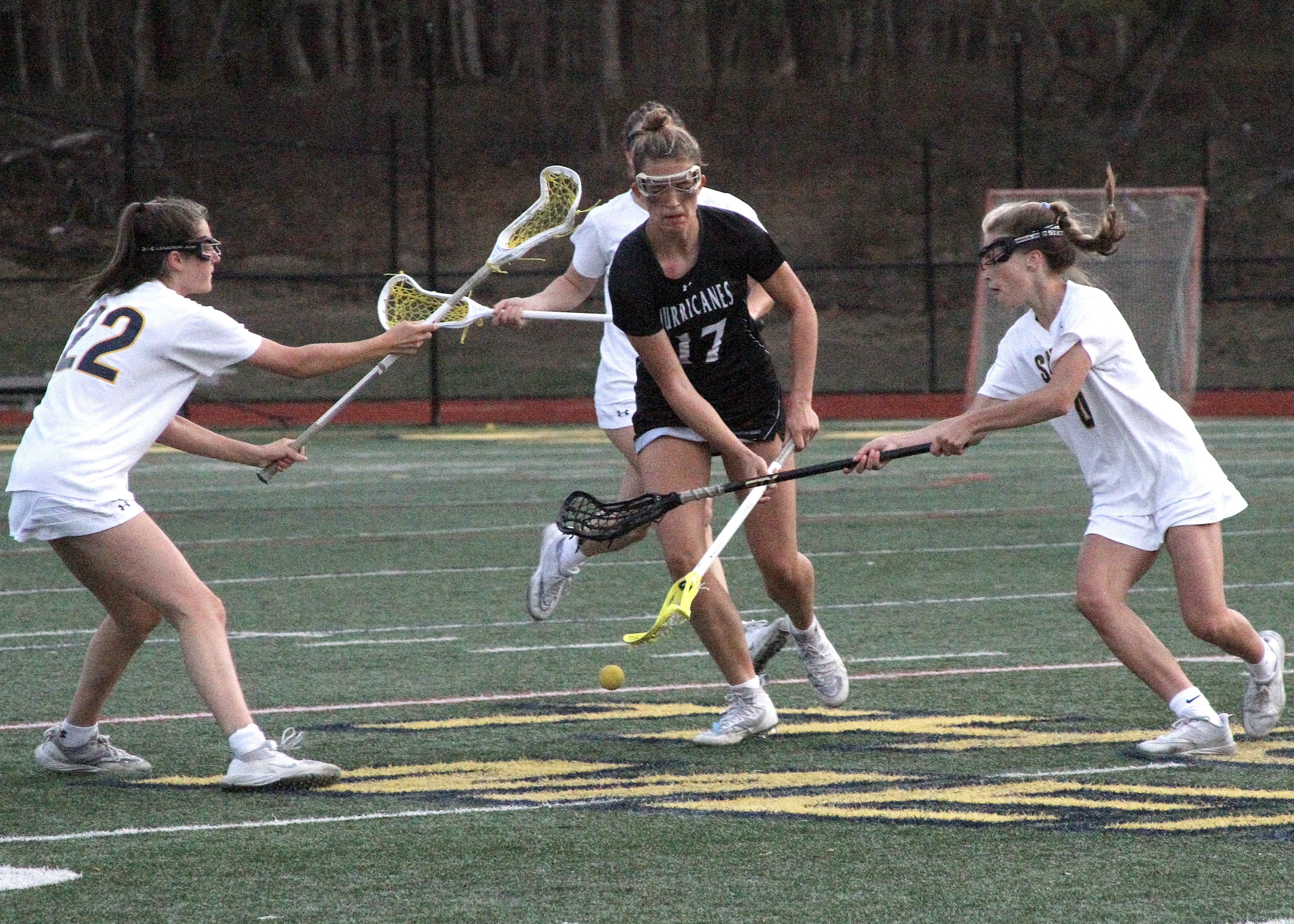 Sophomore midfielder Reese King attempts to scoop up a ground ball. DESIRÉE KEEGAN