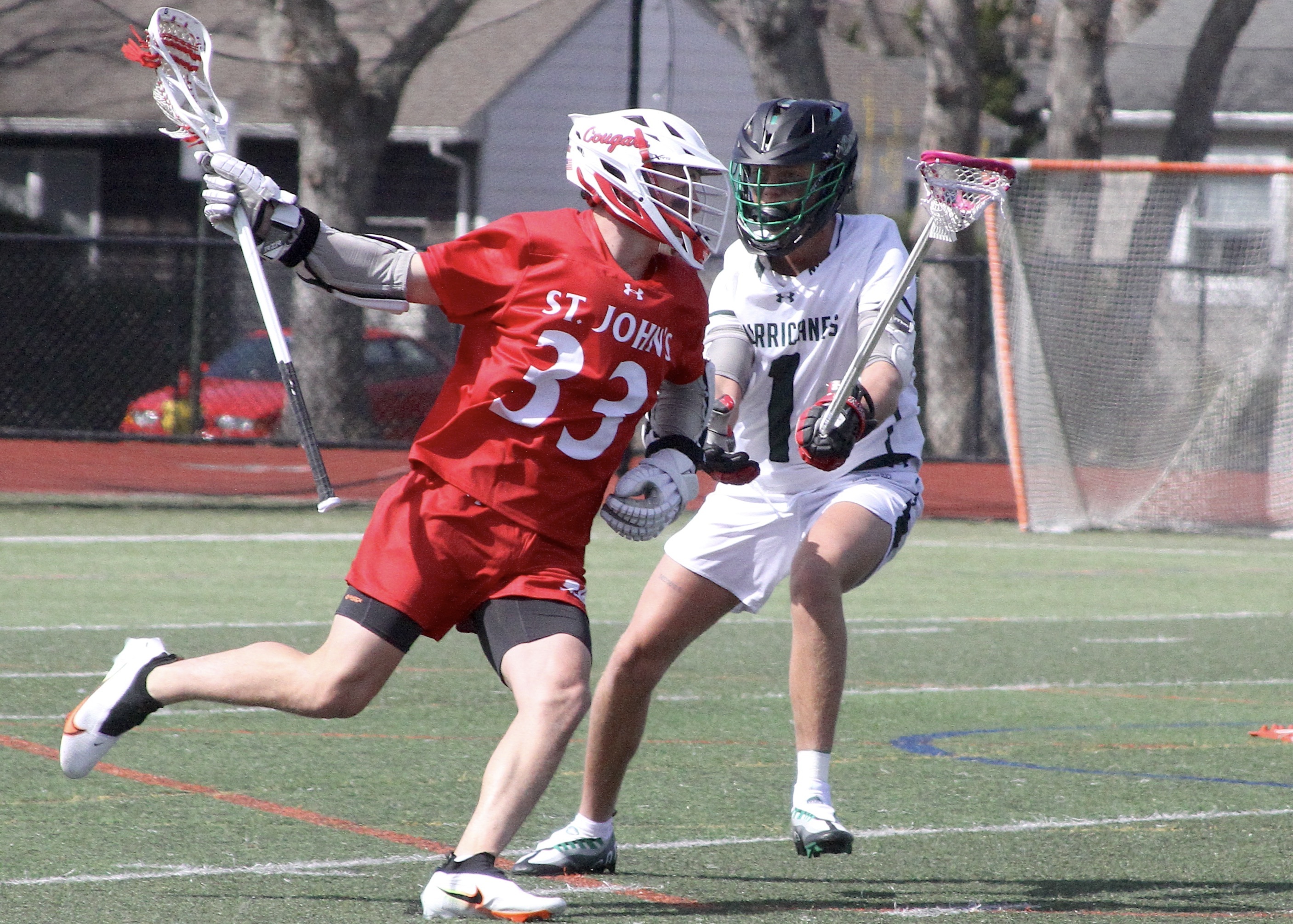 Senior defender Aiden McAuley forces a St. John the Baptist opponent to move outside. DESIRÉE KEEGAN