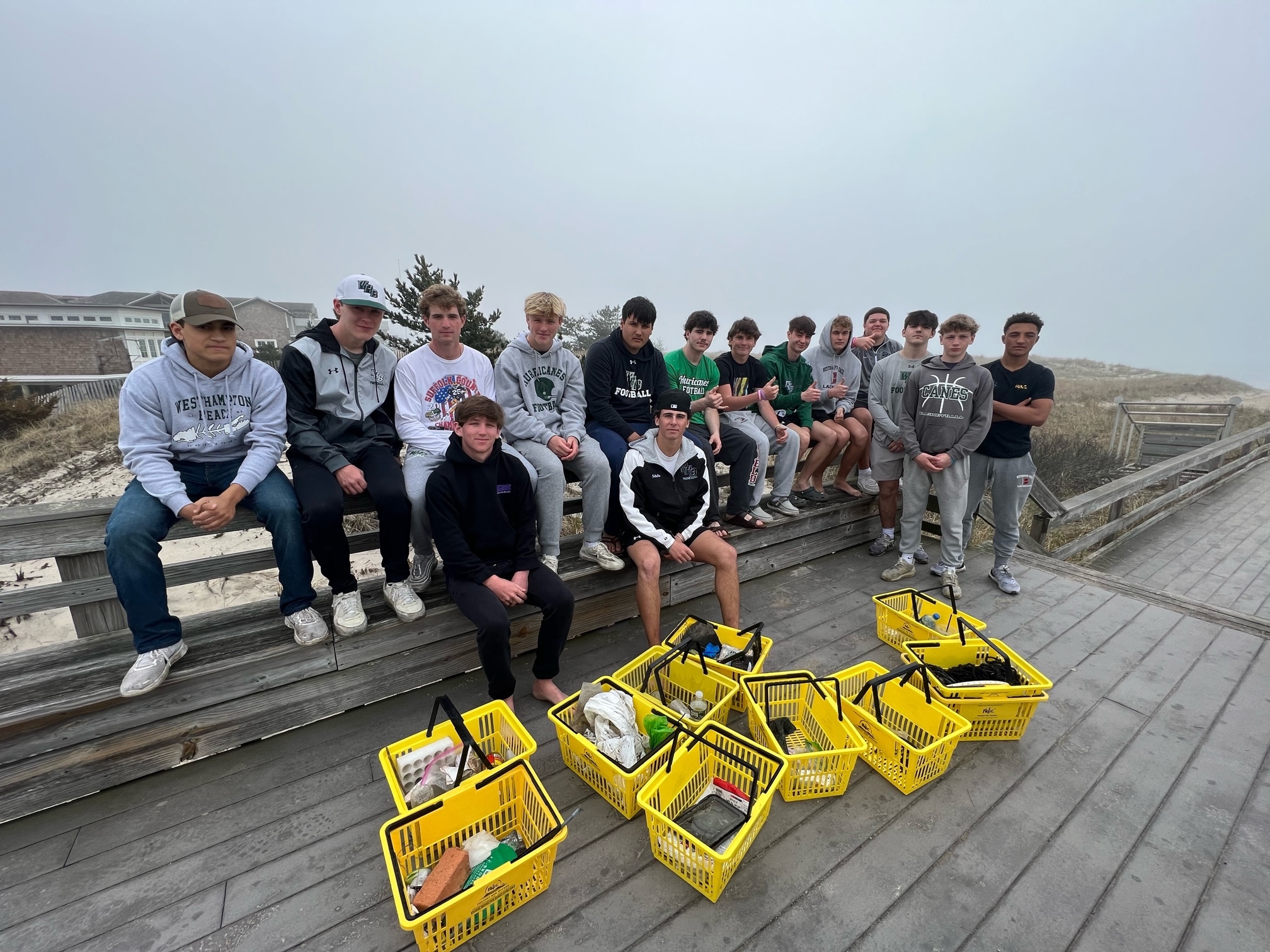 Members of the Westhampton Beach High School varsity football team recently volunteered their time to assist the Moriches Bay Project with a beach cleanup from Cupsogue Beach to Jetty 4. The students collected a total of 1,500 pounds of trash in three hours. COURTESY WESTHAMPTON BEACH SCHOOL DISTRICT