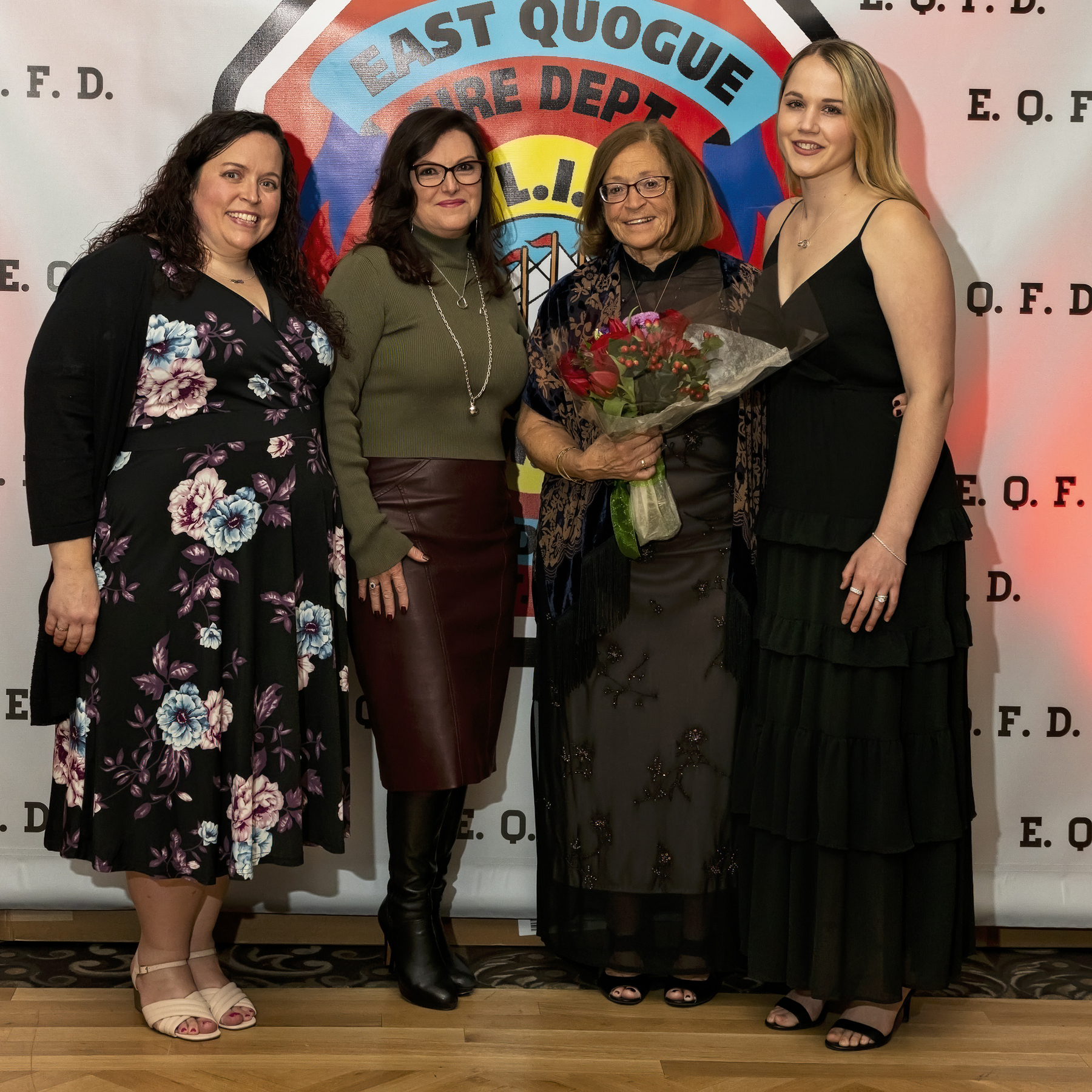 Lois Holley (third from right) was honored for her fifty years of service to the Ladies Auxiliary by the East Quogue Fire Department at its annual installation dinner held at the Long Island Aquarium in Riverhead on Saturday. With her, from left are, Amee Mazurkiewicz, Linda Rousell, and Kristen Rousell.   COURTESY EAST QUOGUE FIRE DEPARTMENT