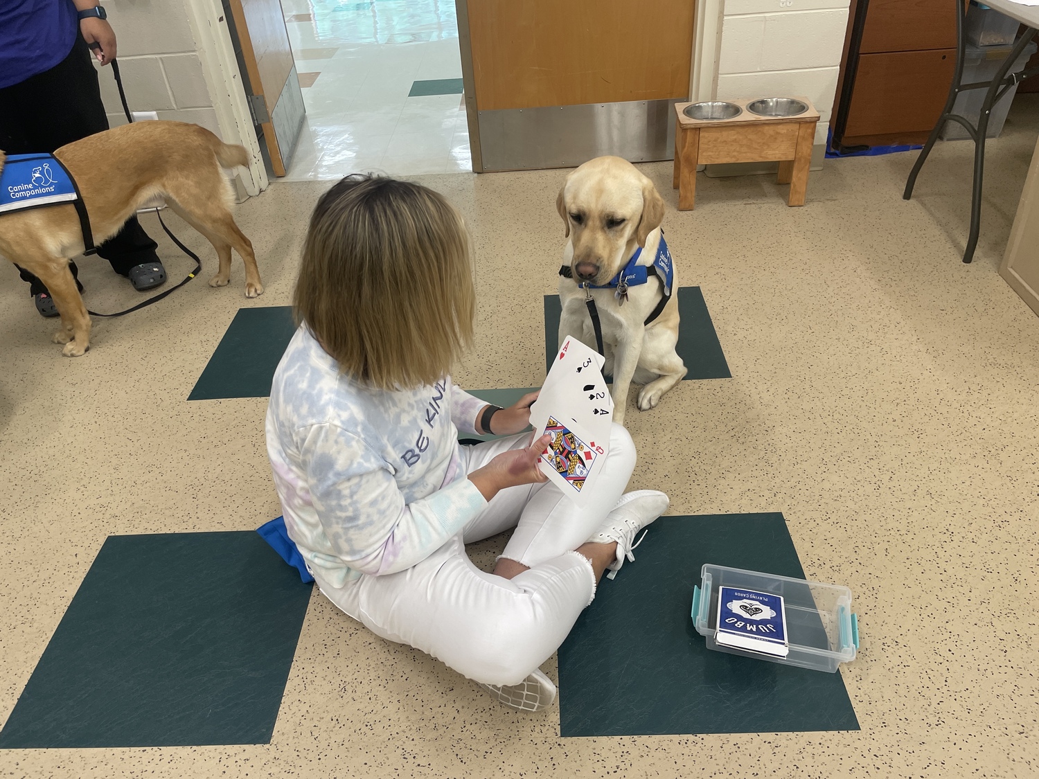 Kate Swezey, a social worker in Westhampton Beach Middle School, with Oric, a dog came to her through the organization Canine Companions, and will serve as a facility dog.