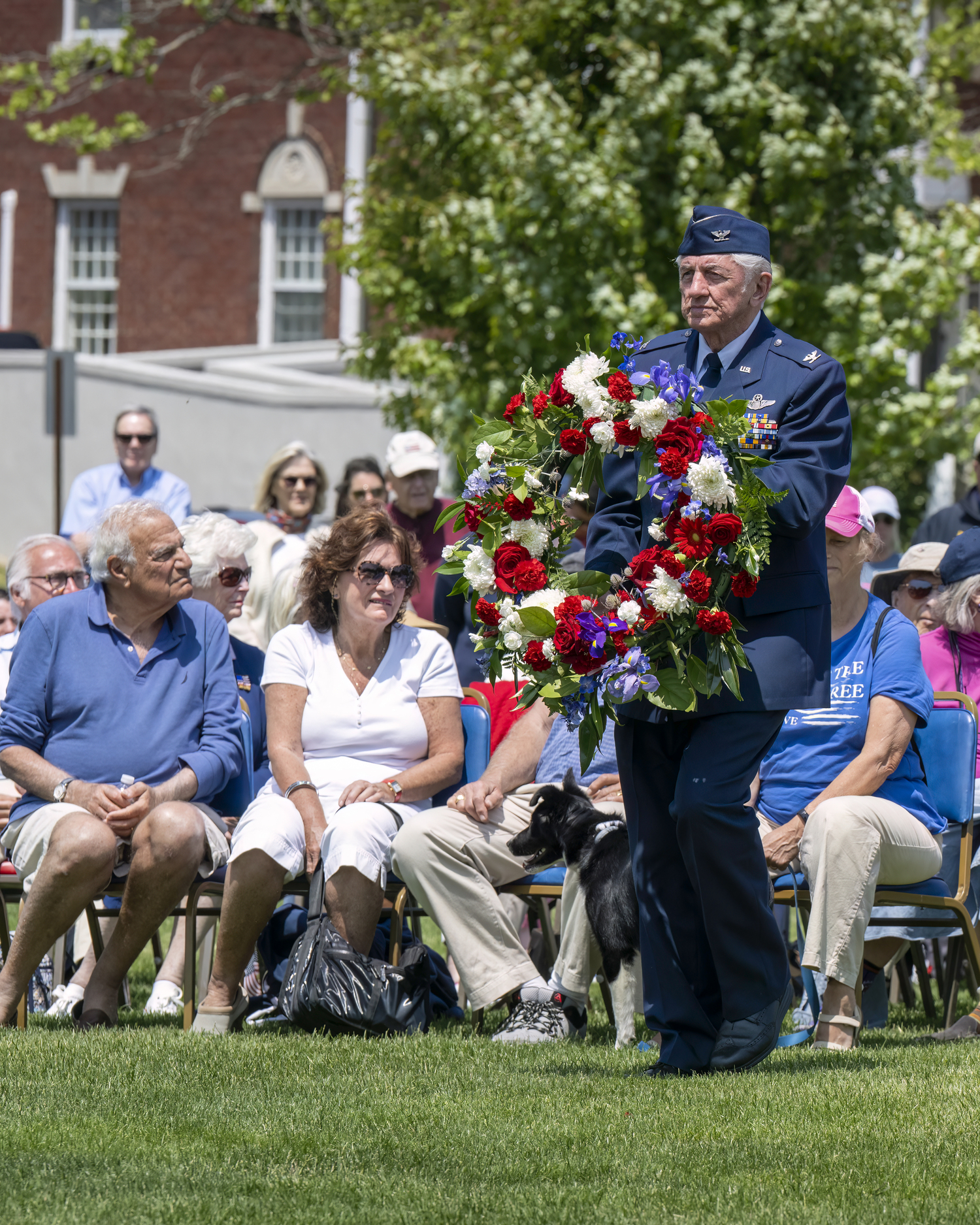 Robert Grisnik places a wreath during the Memorial Day service in Agawam Park in Southampton village on Monday.