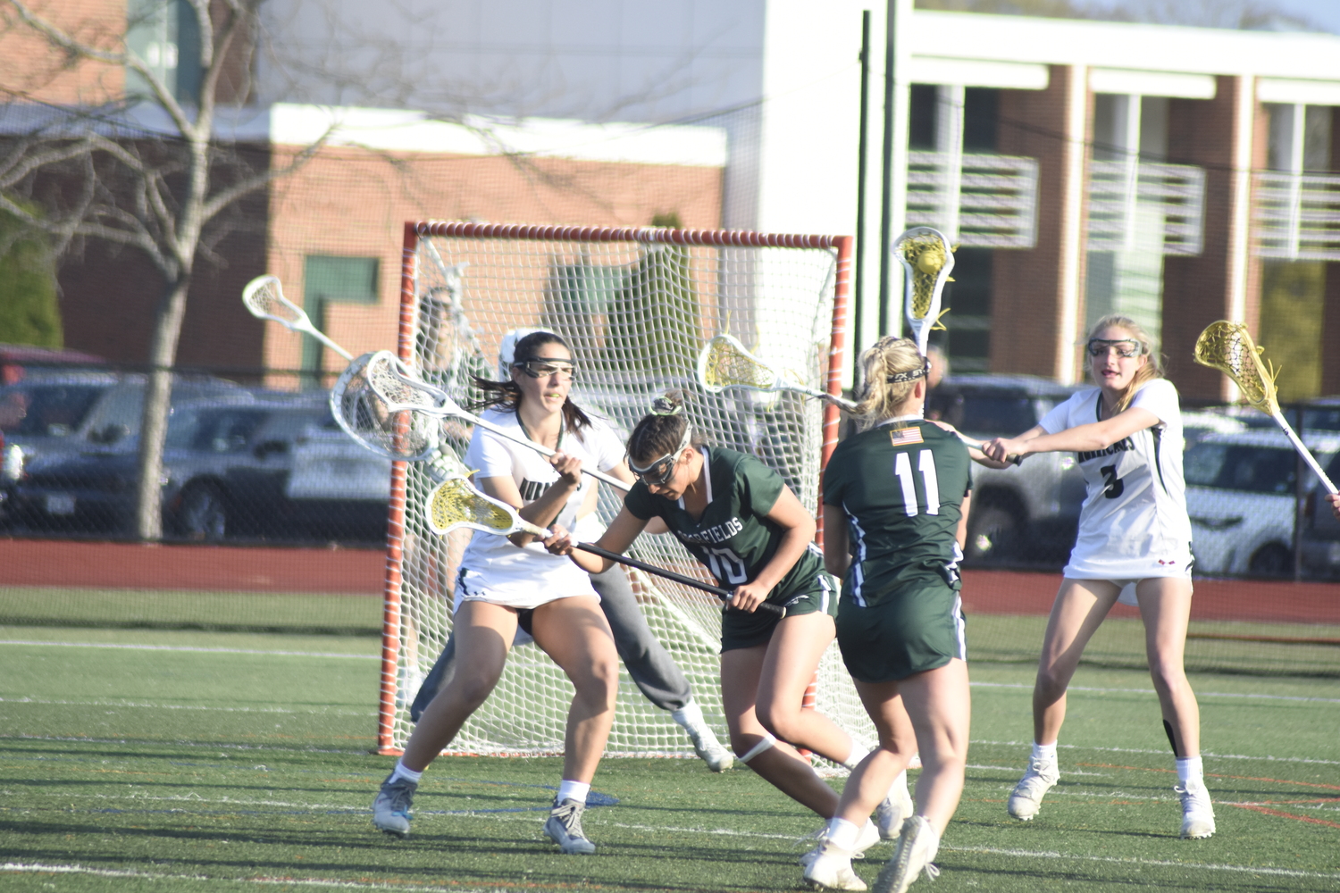 Senior midfielder and defender Reilly Mahon tries to fight through a screen.   DREW BUDD