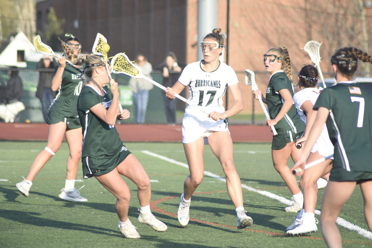 Sophomore midfielder Reese King bears down on a Harborfields player in her defensive zone. DREW BUDD