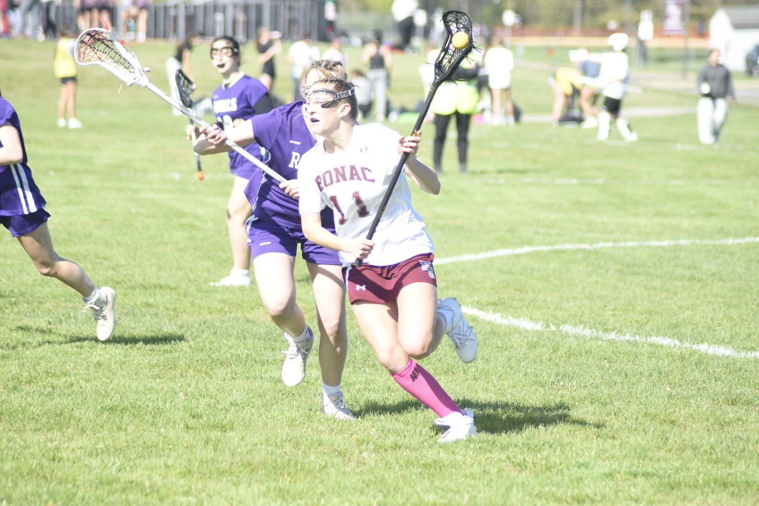 East Hampton sophomore Ava Tintle races the ball out of her team's defensive end.   DREW BUDD