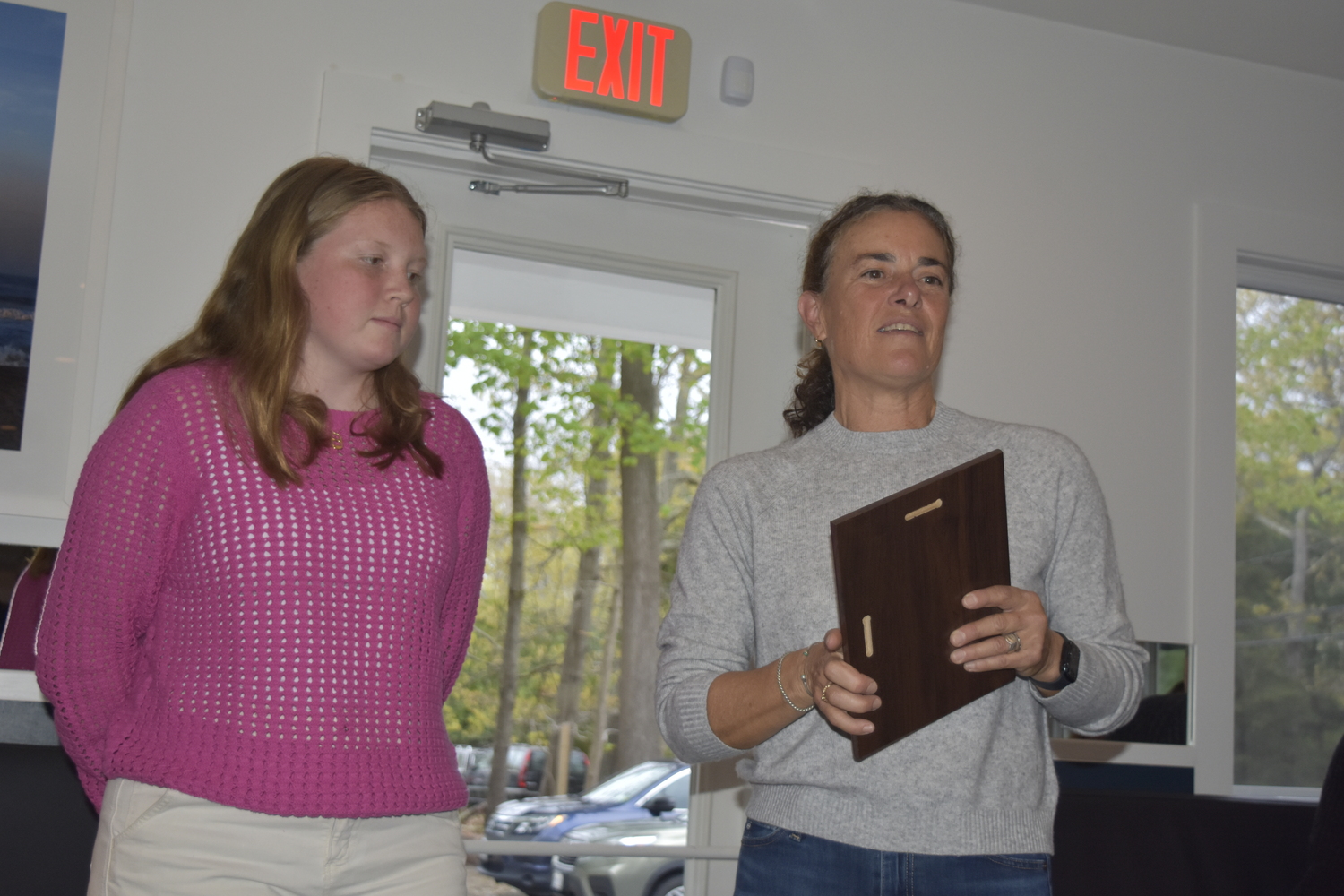 Claire McGovern, left, is given the High School Female Athlete of the Year Award by Sharon McCobb.    DREW BUDD