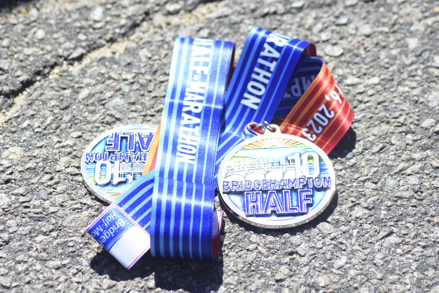 Bridgehampton Half Marathon medals.   DREW BUDD