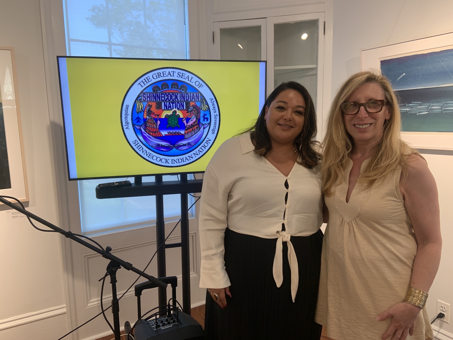 Bianca Collins of the Shinnecock Nation with Bridgehampton Museum director Nina Rayburn Dec after Collins's talk on the tribe's efforts to protect burial grounds and repatriate remains.  STEPHEN J. KOTZ