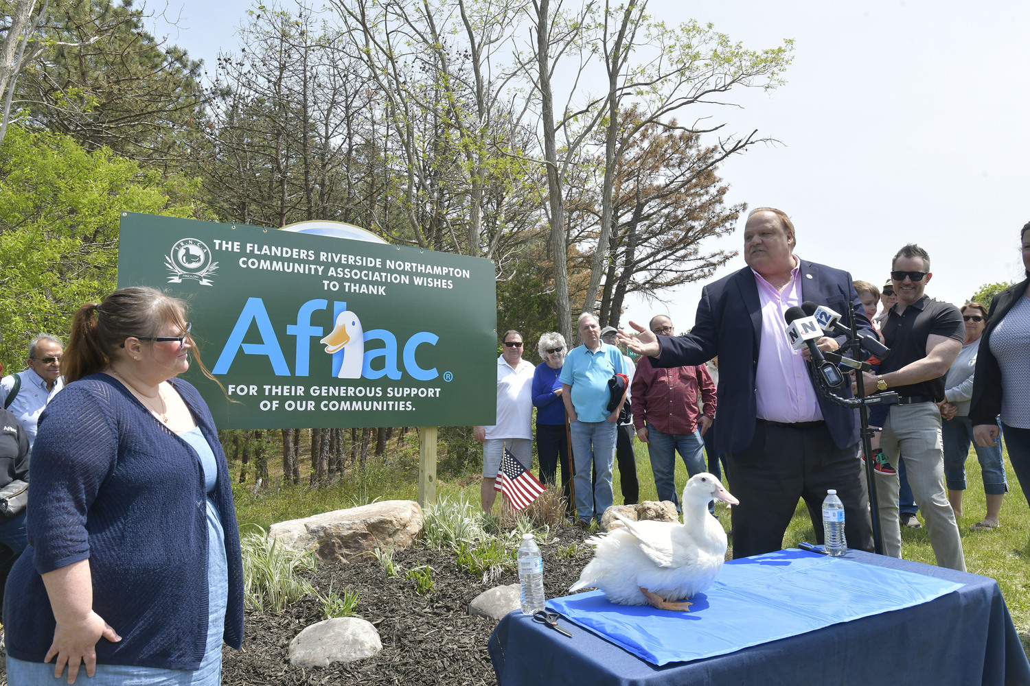 Angela Huneault, Left,  president of FRANCA and Southampton Town Councilman Rick Martel, right, at the unveiling of the new sign on Monday afternoon.  DANA SHAW