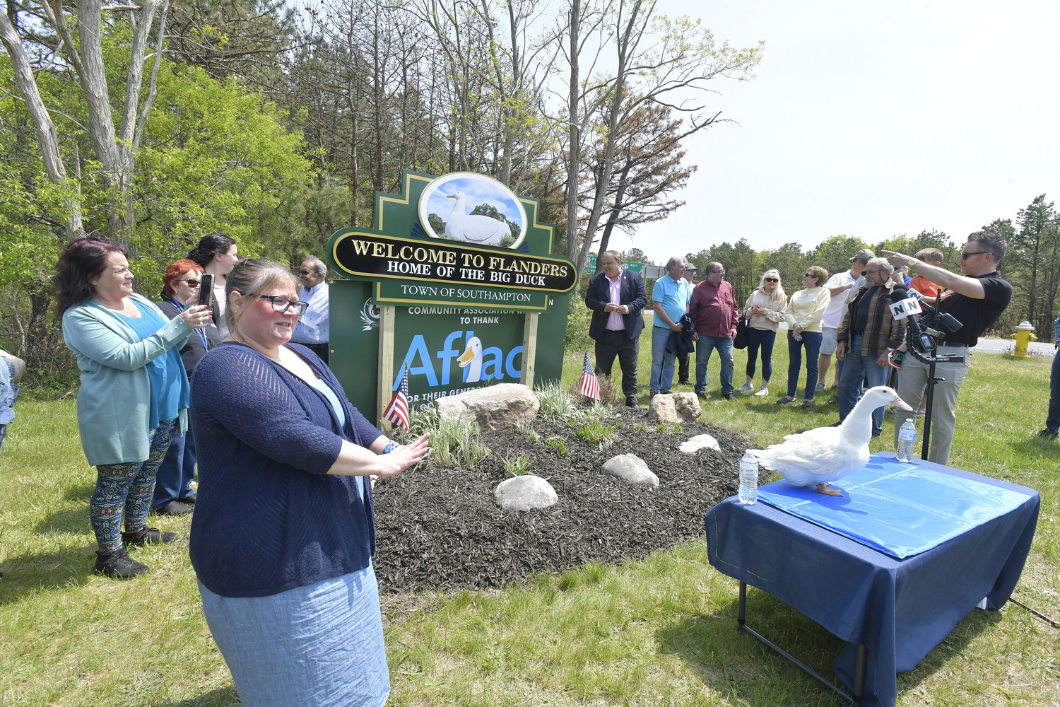 FRANCA President Angela Huneault welcomes visitors and the AFLAC Duck to the unveiling of the new sign on Monday afternoon.   DANA SHAW