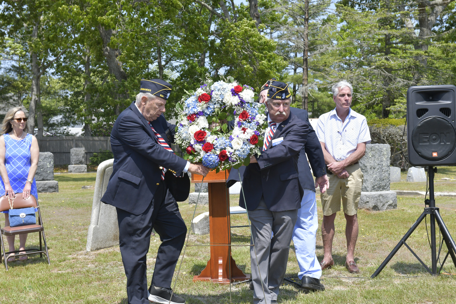 American Legion Commander Thomas Hadlock and Mike Pankowski lay a wreath at the memorial at Westhampton Cemetery on Monday.