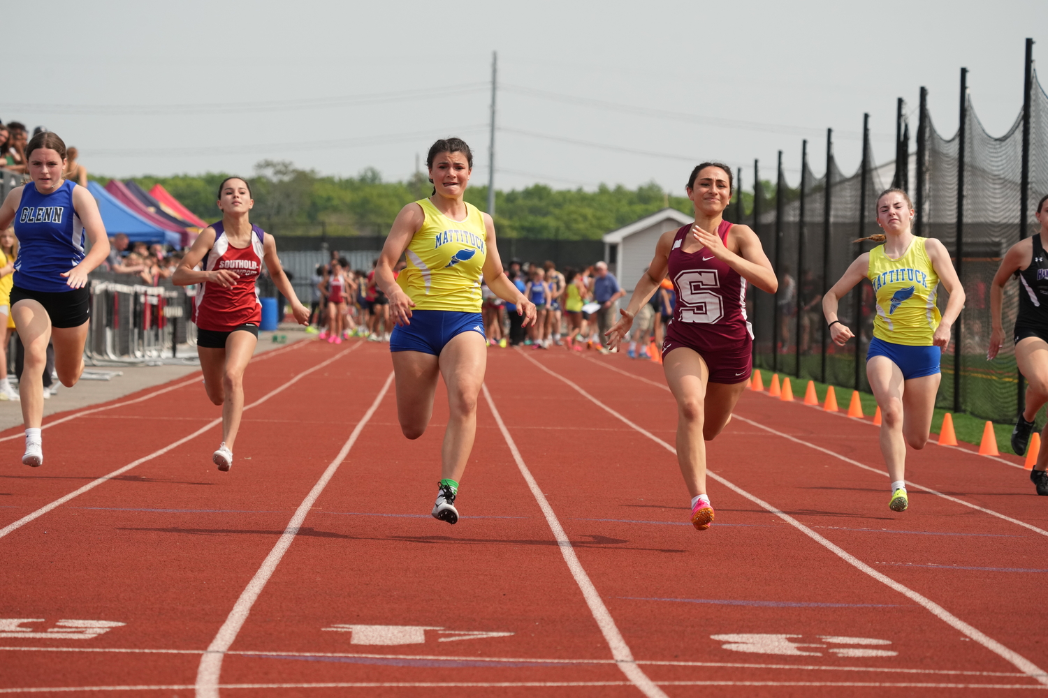 Southampton junior Kyla Cerullo races toward the finish line in the 100-meter dash in which she placed fourth.   RON ESPOSITO