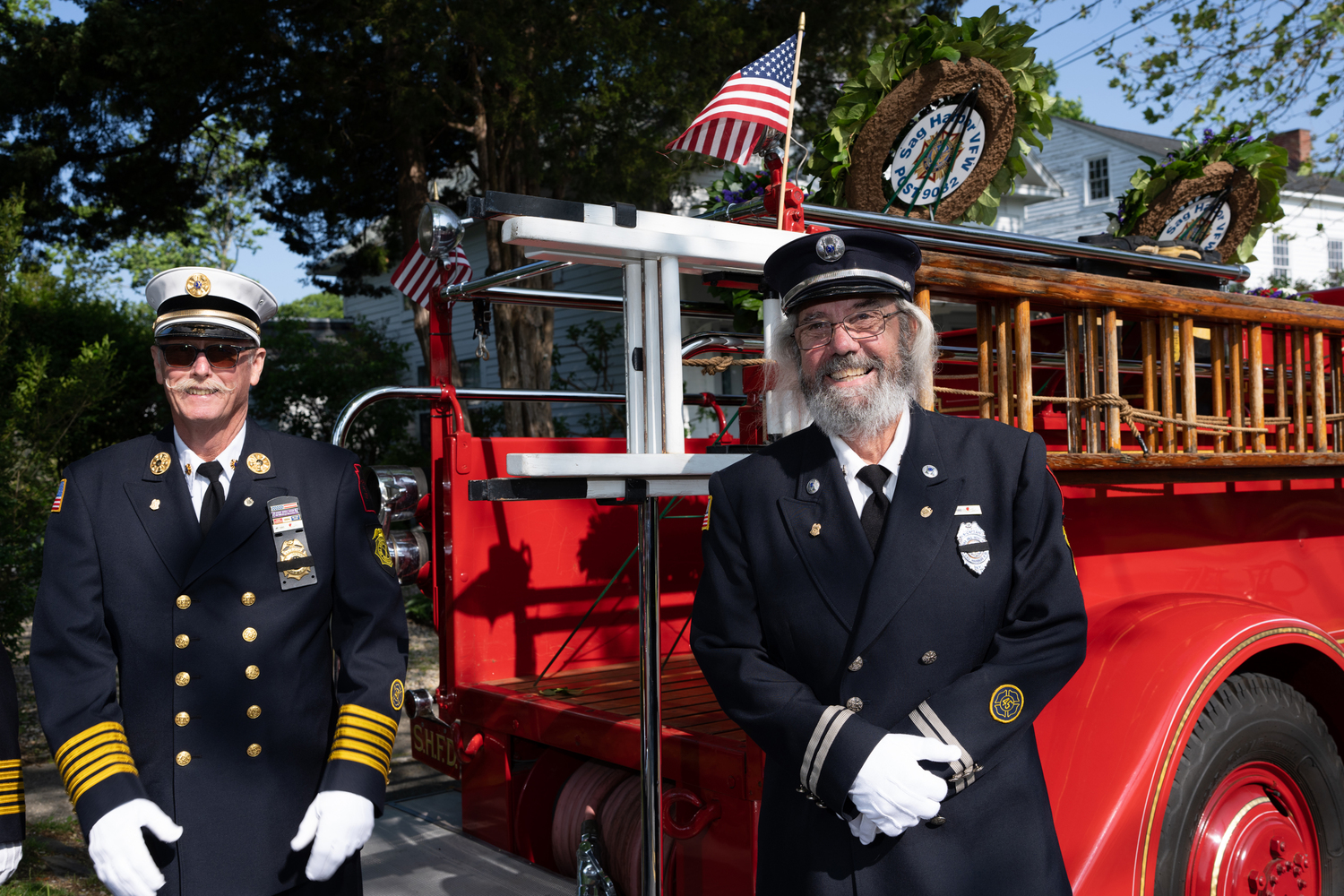 Sag Harbor firefighters with one of the department's antique trucks. LORI HAWKINS