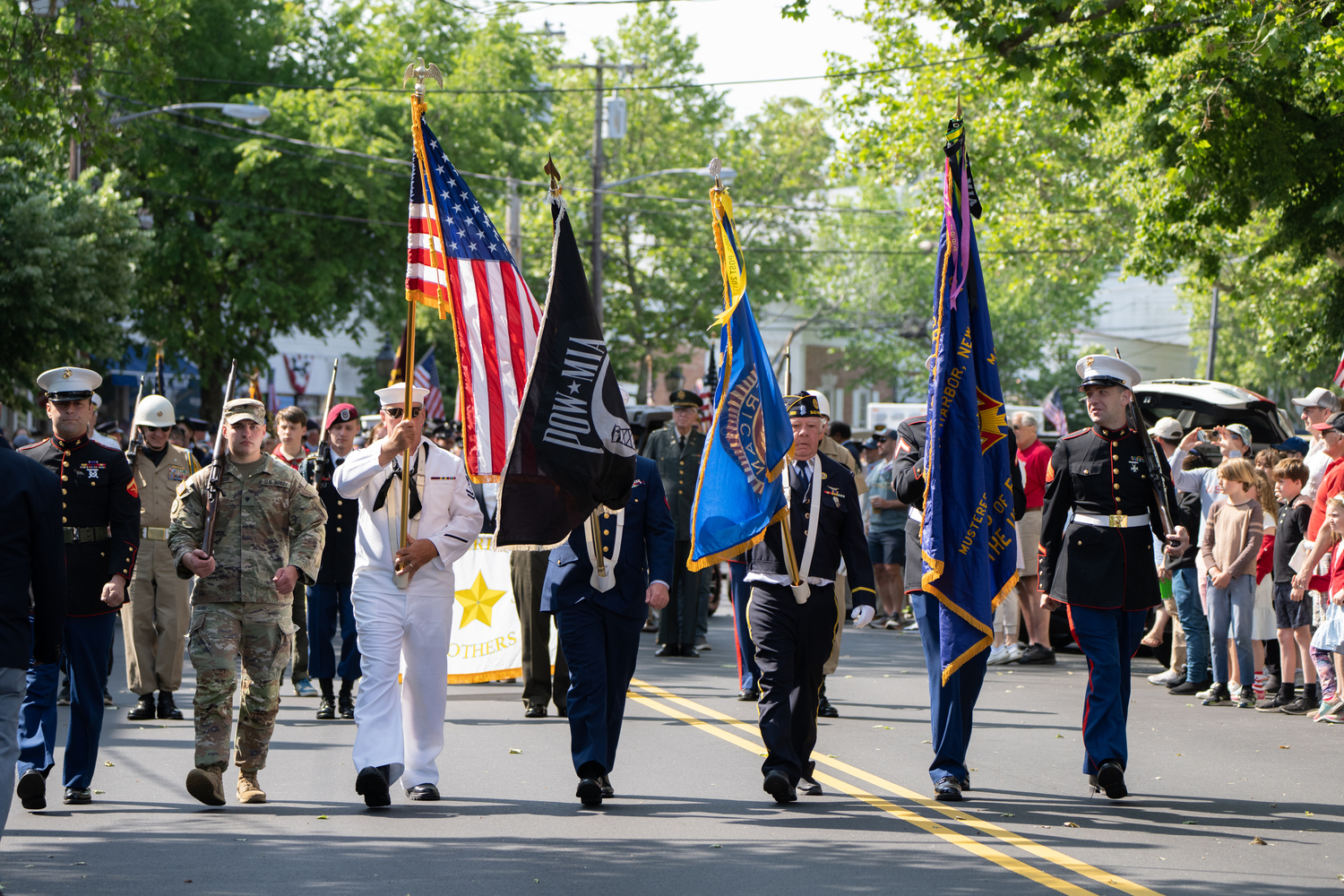 A military color guard makes it way down Main Street in Sag Harbor's annual Memorial Day parade. LORI HAWKINS