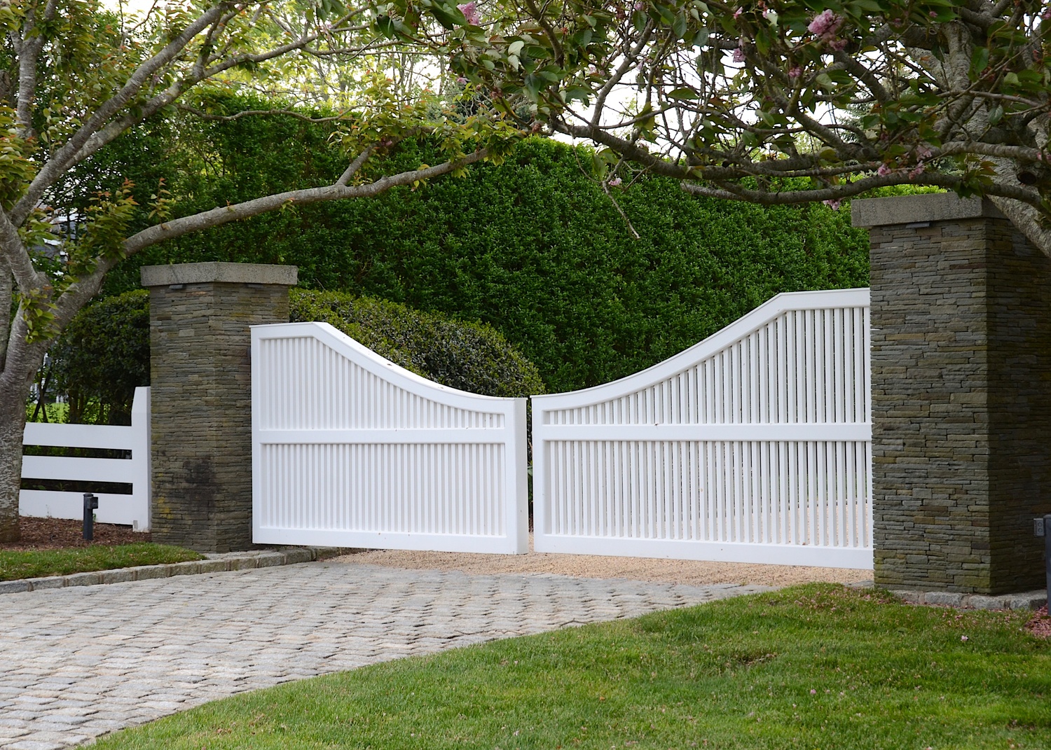 The question of whether to ban driveway gates in Sagaponack Village was debated at a public hearing on May 10. Many residents said they believe the gates are essential to keep their children and pets safe.  KYRIL BROMLEY