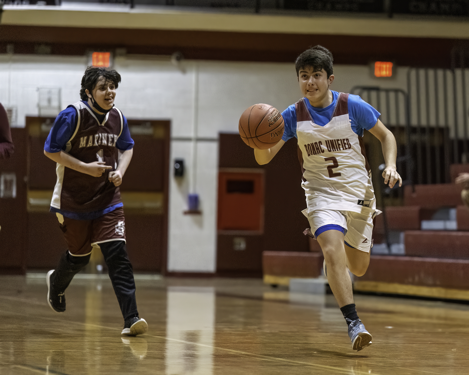 Bonacker Miczar Garcia races the ball down the court.    MARIANNE BARNETT