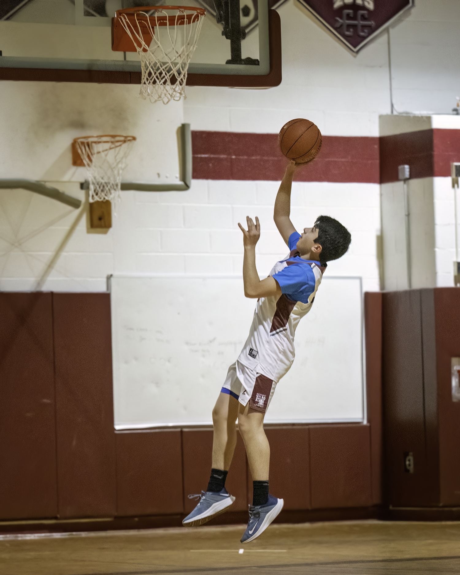 An East Hampton player goes up for a layup.    MARIANNE BARNETT