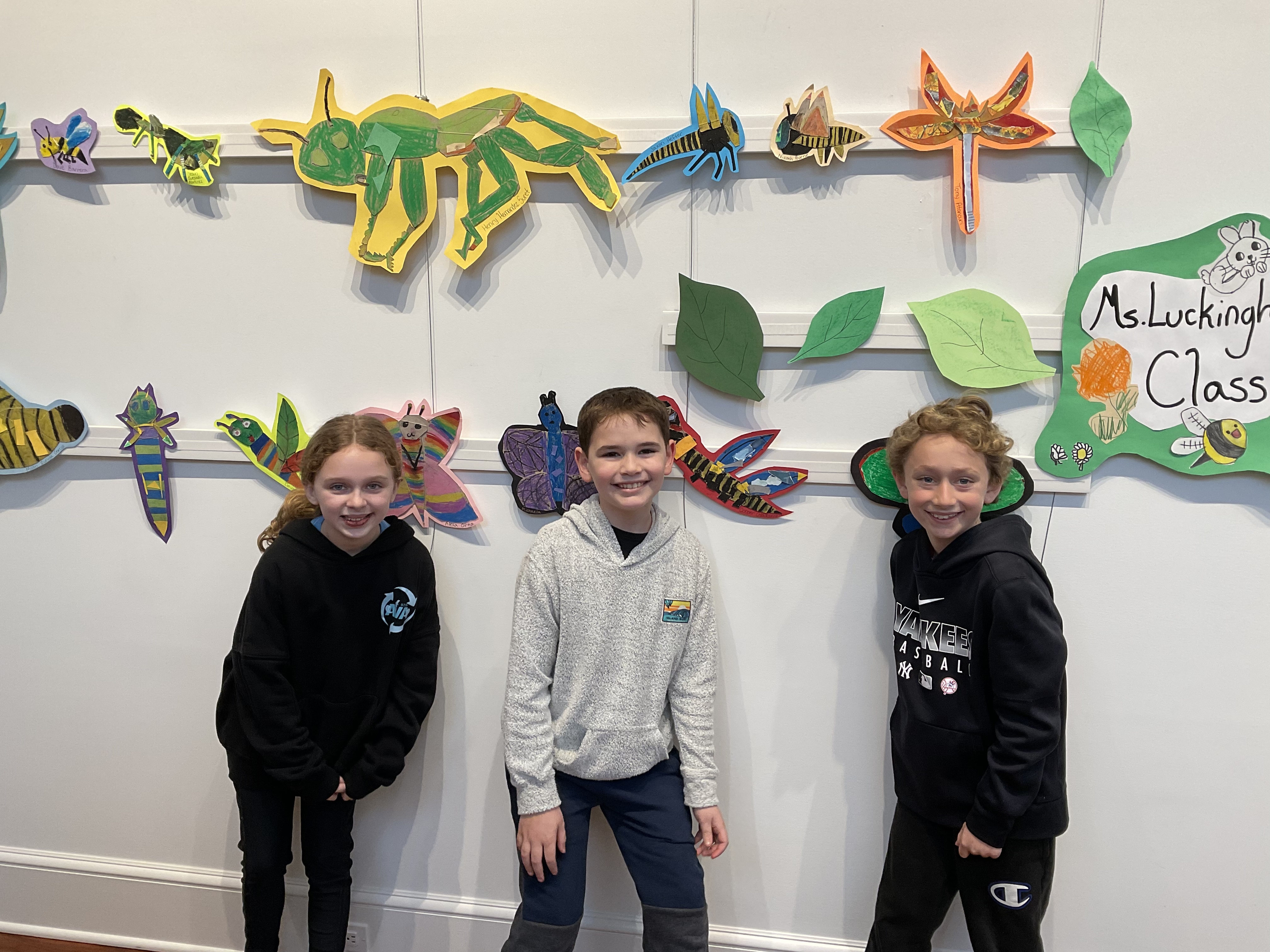 Third graders from Ms. Luckingham’s class at East Quogue School with their artwork that is hanging in the Quogue Library Gallery. Art teacher Ms. Rosenberg had students create artistic renderings of insects. COURTESY EAST QUOGUE SCHOOL
