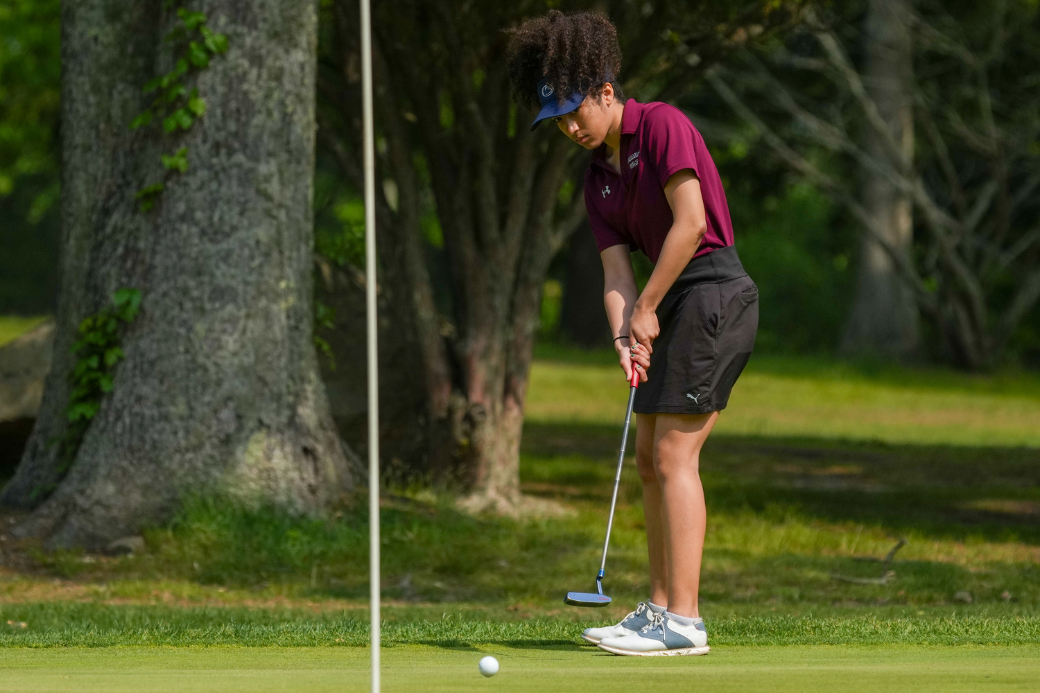 Southampton senior Ella Coady putts during the Suffolk County Girls Golf Championships at Middle Island Golf Club on Tuesday.   RON ESPOSITO