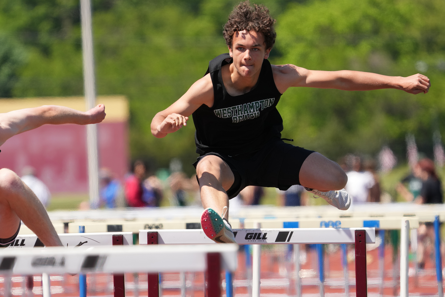 Westhampton Beach sophomore Ezekiel McCrary competing in the 110-meter high hurdles at counties.   RON ESPOSITO