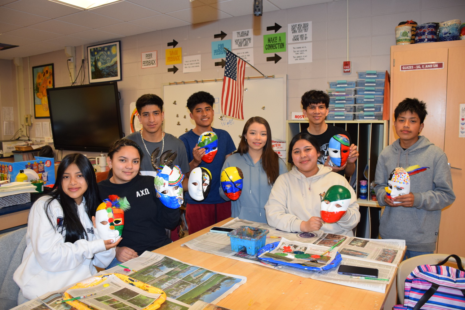 A grant from the Partners in Education, Arts and Community Empowerment Program and the Patchogue Arts Council has offered Hampton Bays High School students a way to creatively express themselves through poetry and art with the assistance of author Adriana Devers.
Through the grant, obtained by teacher Daniela Vargas, English as a new language students explored poetry and wrote poems about their culture, identity and country. Then they decorated and painted masks that reflected what they wrote about. The students’ work will be displayed at their school for a family and friends showcase. COURTESY HAMPTON BAYS SCHOOL DISTRICT