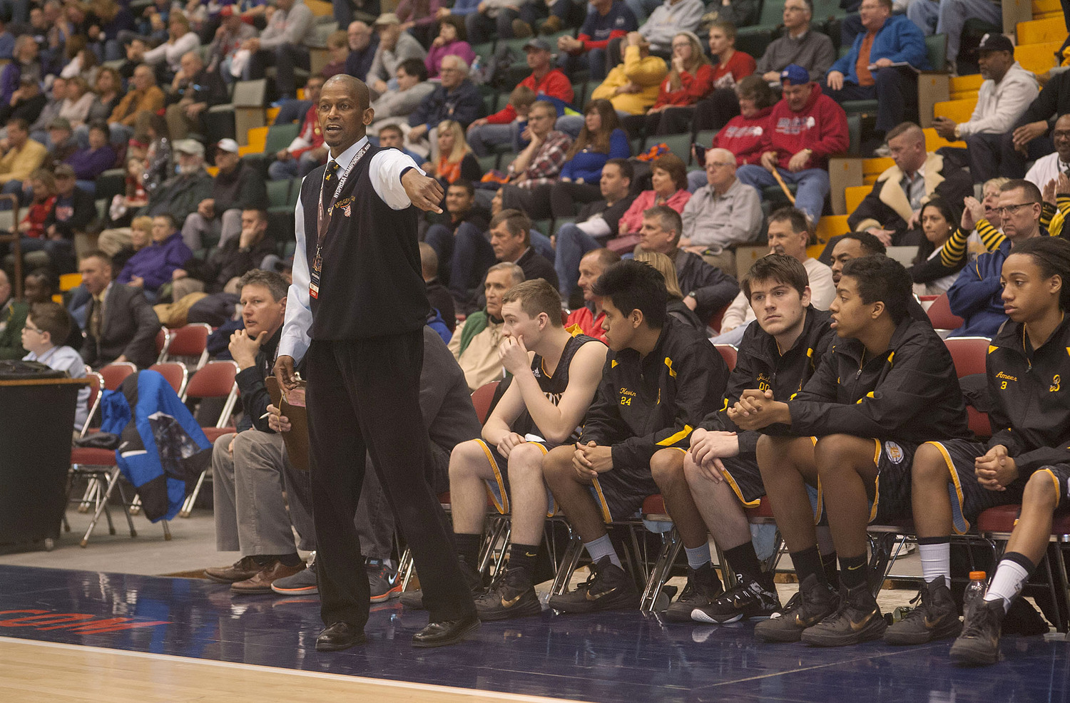 Carl Johnson coaching the Killer Bees during the New York State Class D semifinal.    MICHAEL HELLER