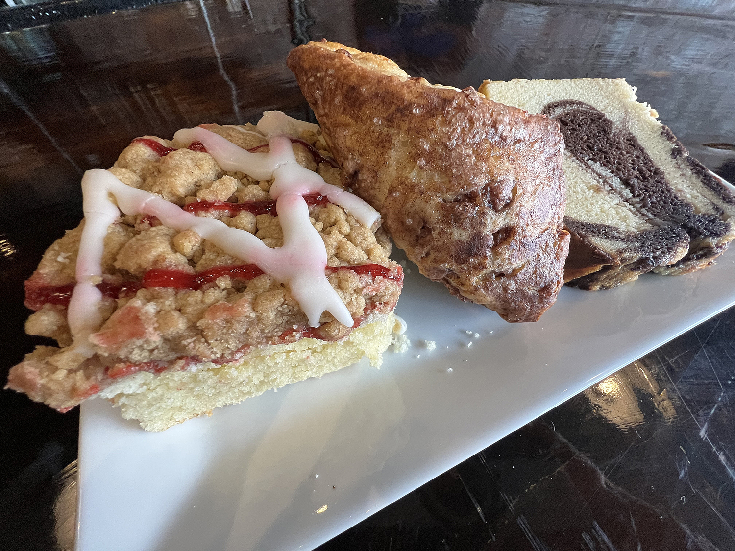 The crumb cake, cinnamon scone and marble pound cake at Mugs on Main.  DANA SHAW