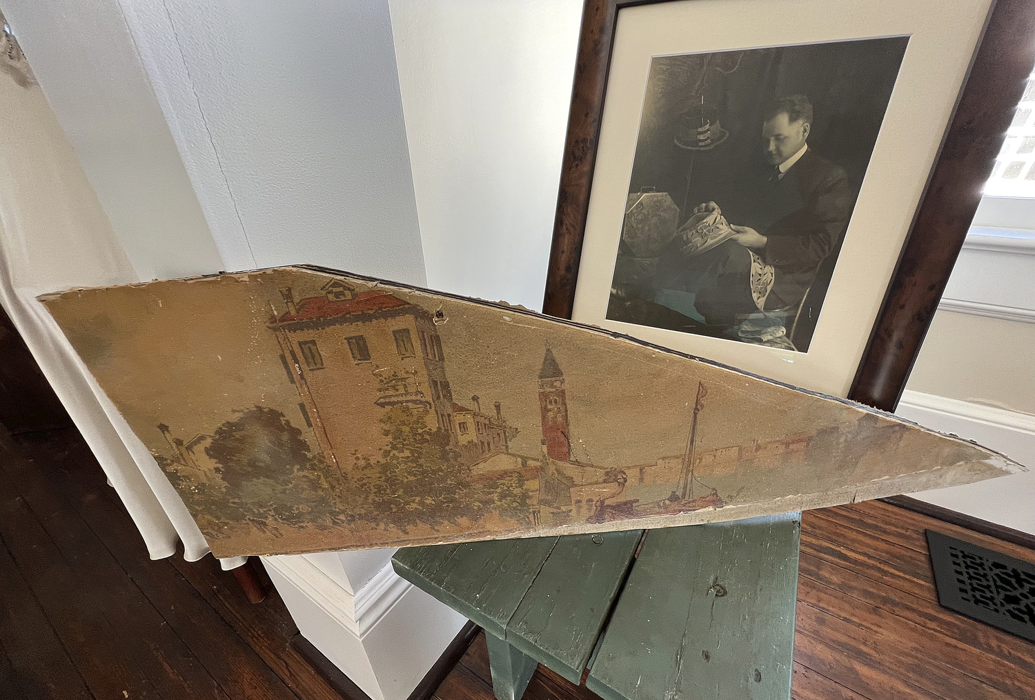 A damaged portion of a mural depicting Venice on the upstairs wall. The damaged mural was recreated by artist Marc Potocsky when the shop was restored.  DANA SHAW