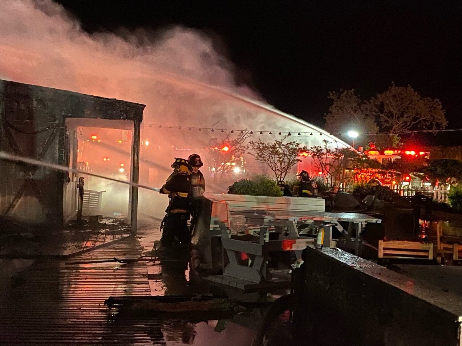 A midnight fire destroyed the barn-like waterfront restaurant building that for years was home to Rick’s Crabby Cowboy Cafe on East Lake Drive in Montauk.  
 COURTESY SCOTT SNOW