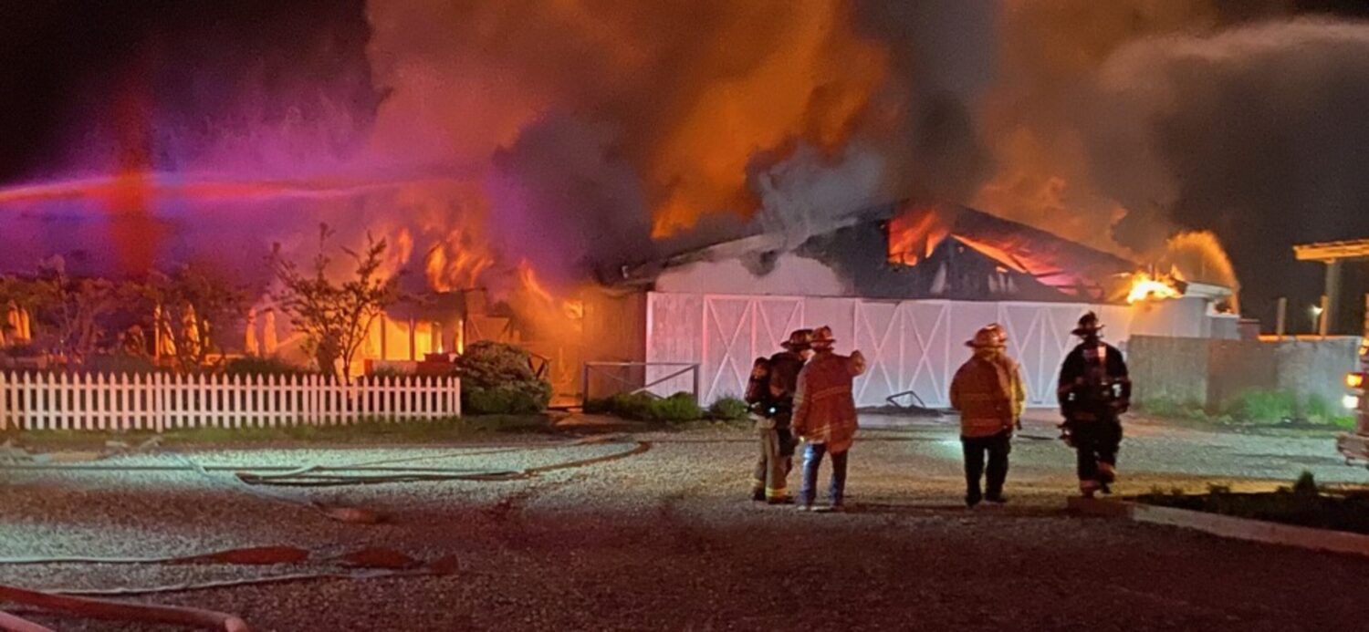 A midnight fire destroyed the barn-like waterfront restaurant building that for years was home to Rick’s Crabby Cowboy Cafe on East Lake Drive in Montauk. COURTESY SCOTT SNOW