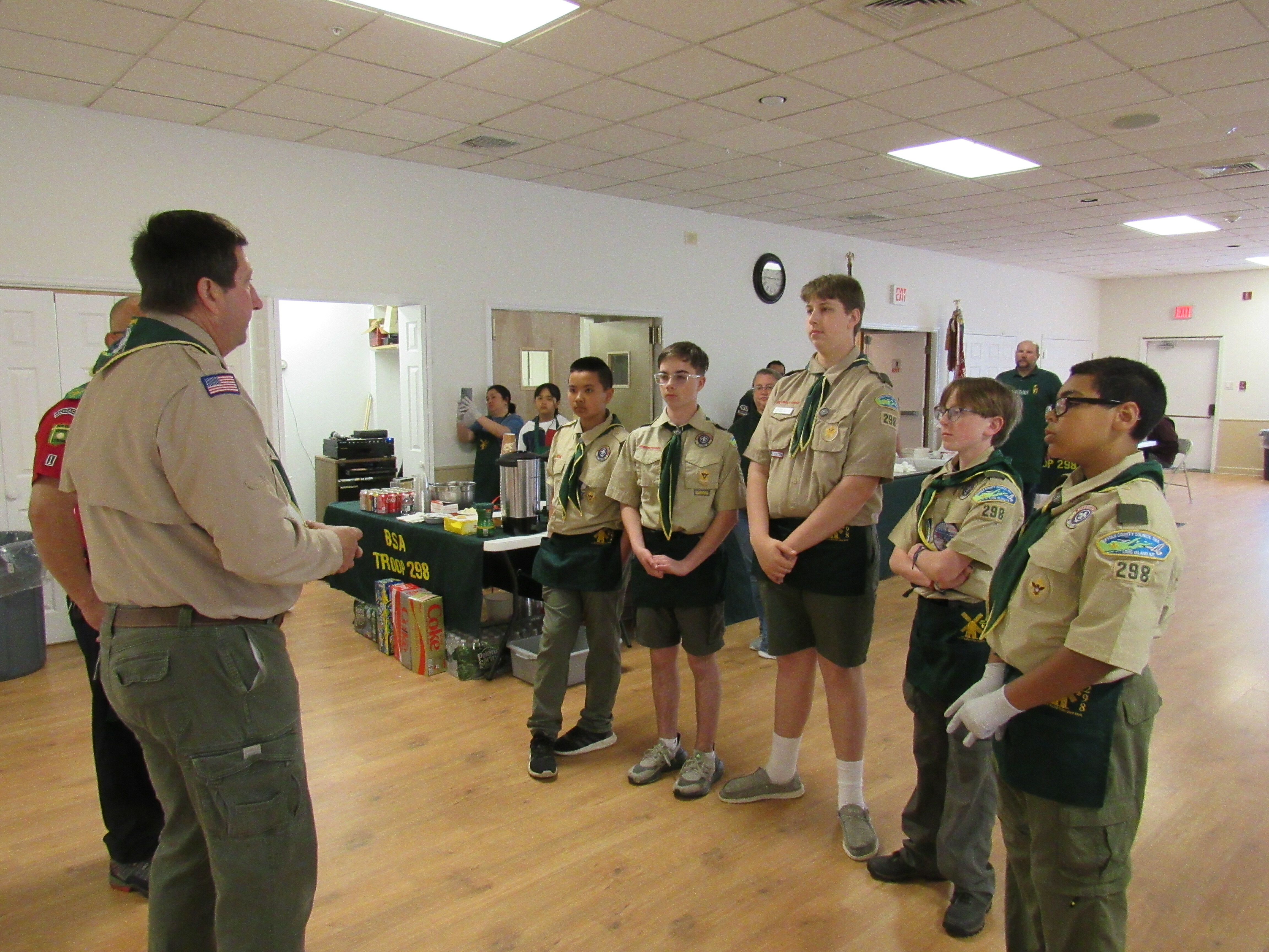 Scoutmaster Pat Brabant, goes over last minute details with the Scouts before the dinner begins at the American Legion Hall. Standing from left,  Jerry Nguyen,  Eddie Bedell, PJ Brabant, Tyler Plambeck and Elias Morgan. COURTESY TROOP 298